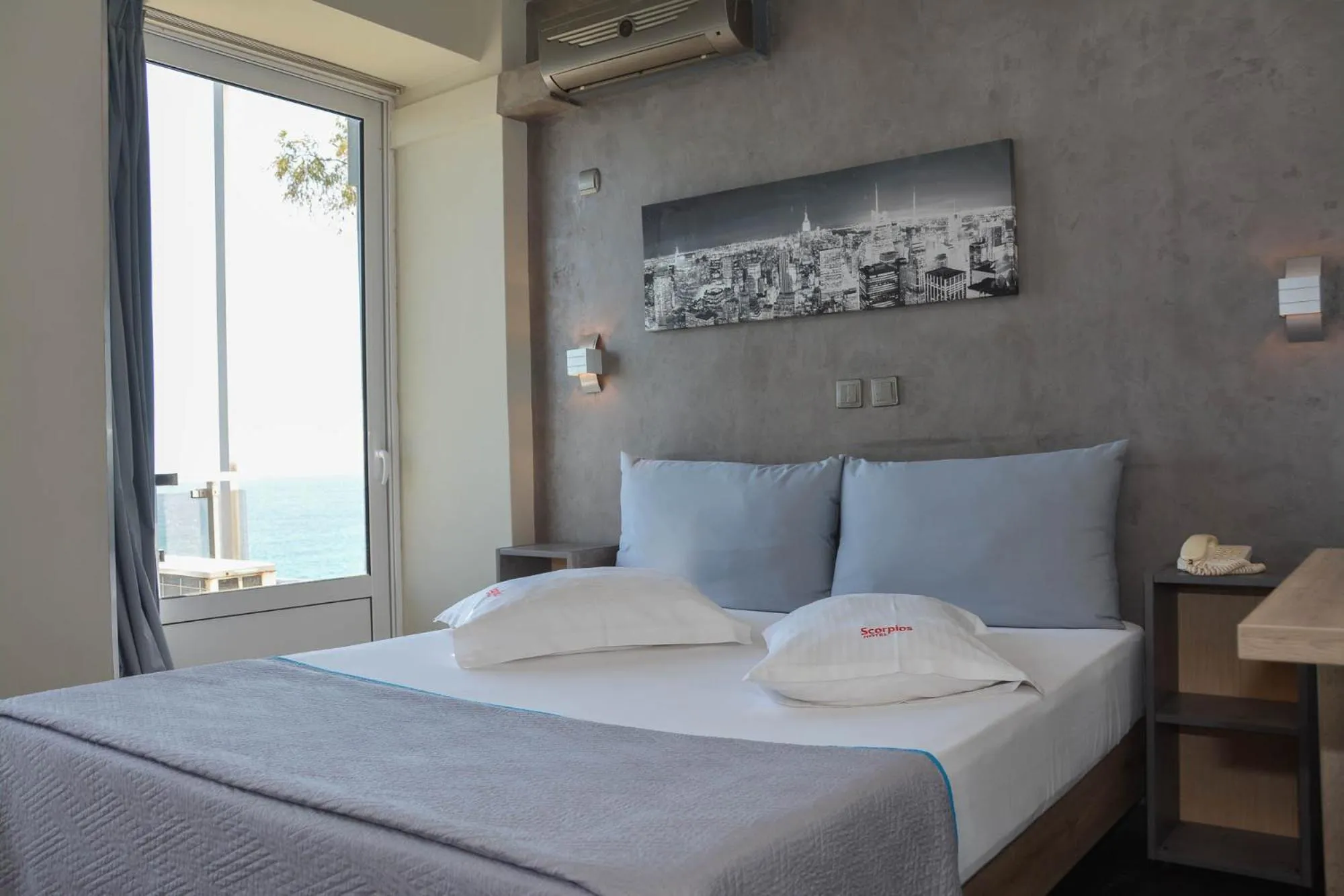 Bed in Scorpios Sea Side Hotel