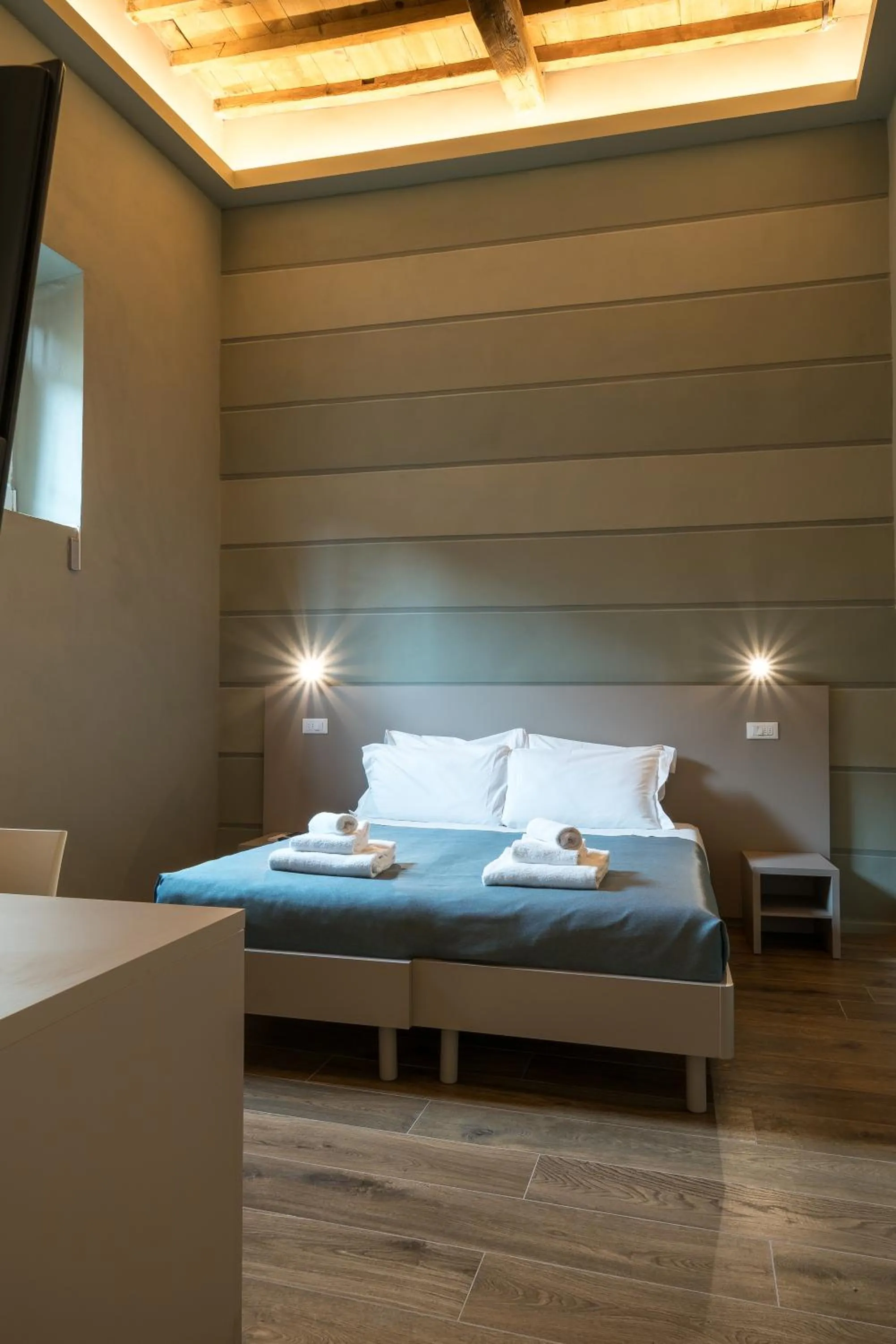 Bed in GOGO` Petit Hotel