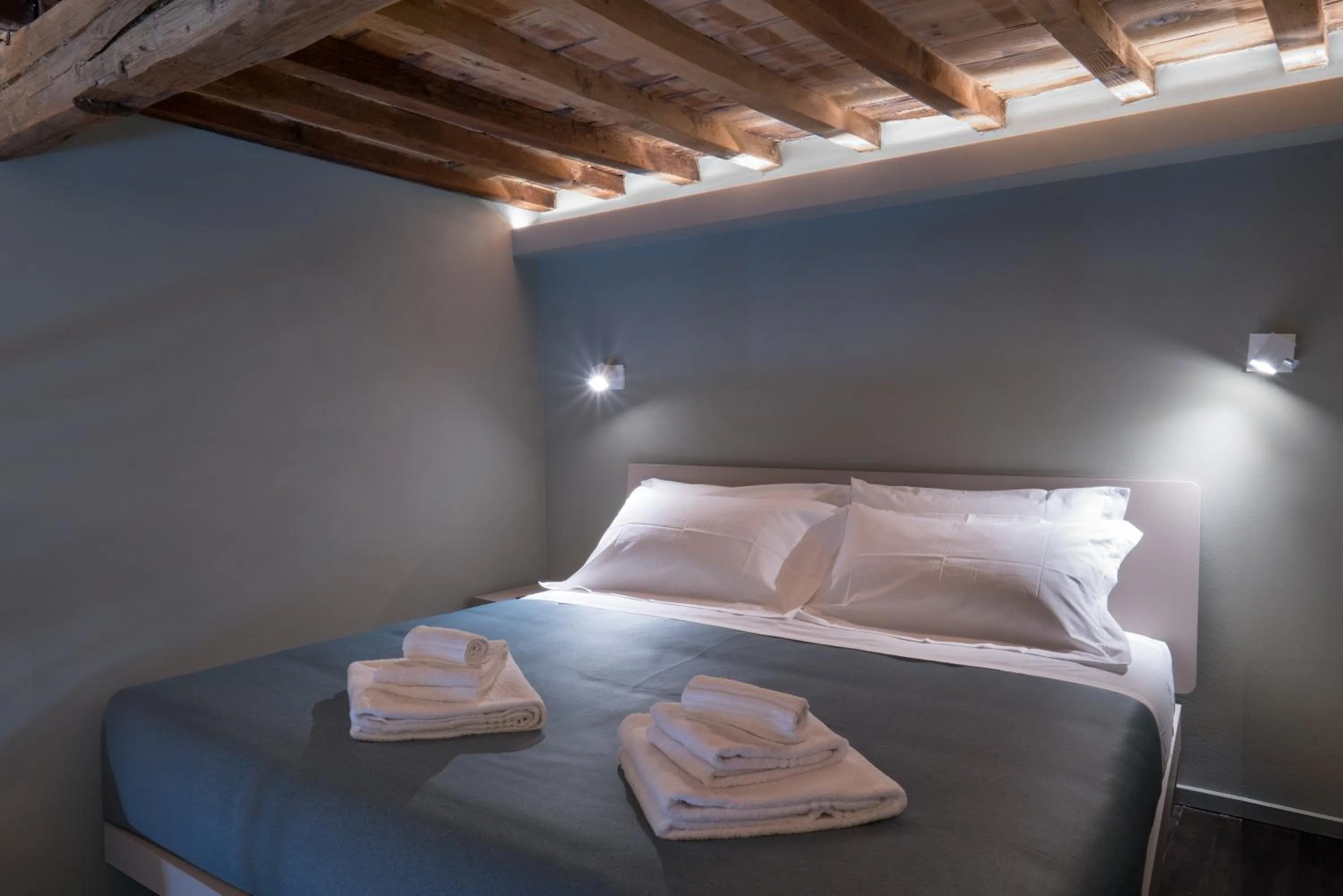 Bed in GOGO` Petit Hotel