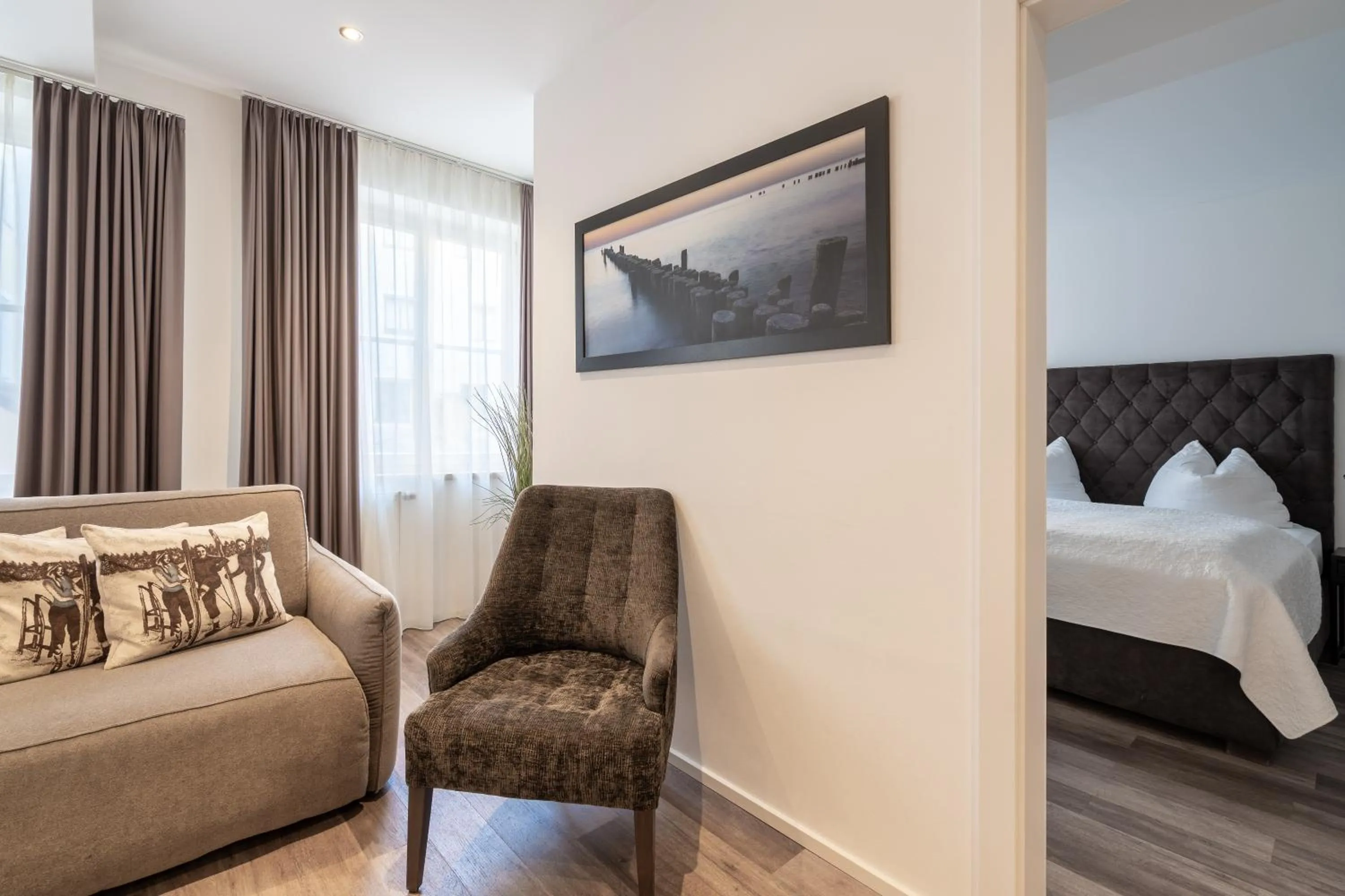 Living room, Bed in Kaiser Max Design Appartements