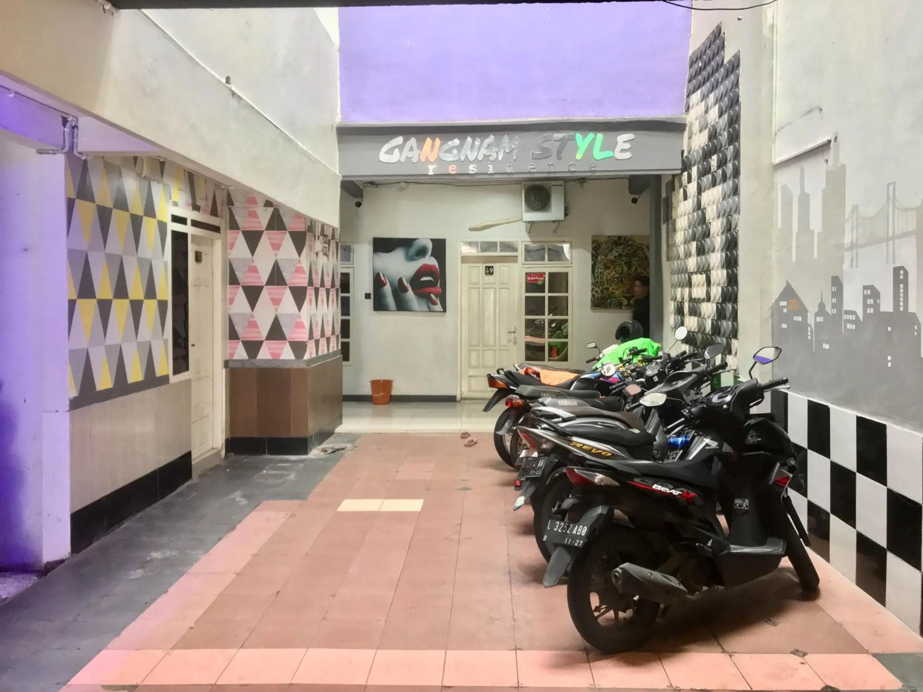 Parking in Gangnam Style Residence Mitra RedDoorz near MERR Surabaya