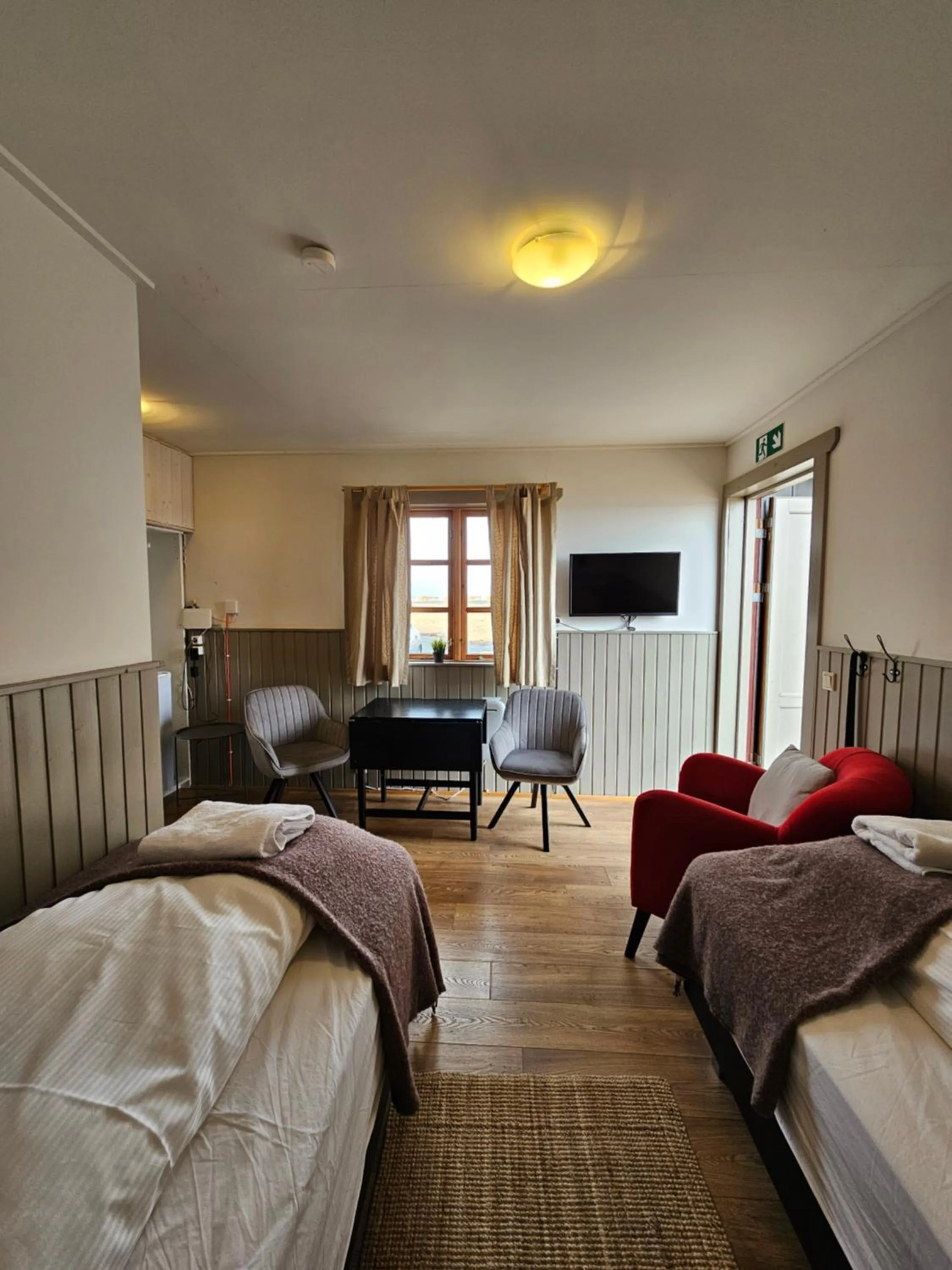 Bed in Riverfront Lodge Hella