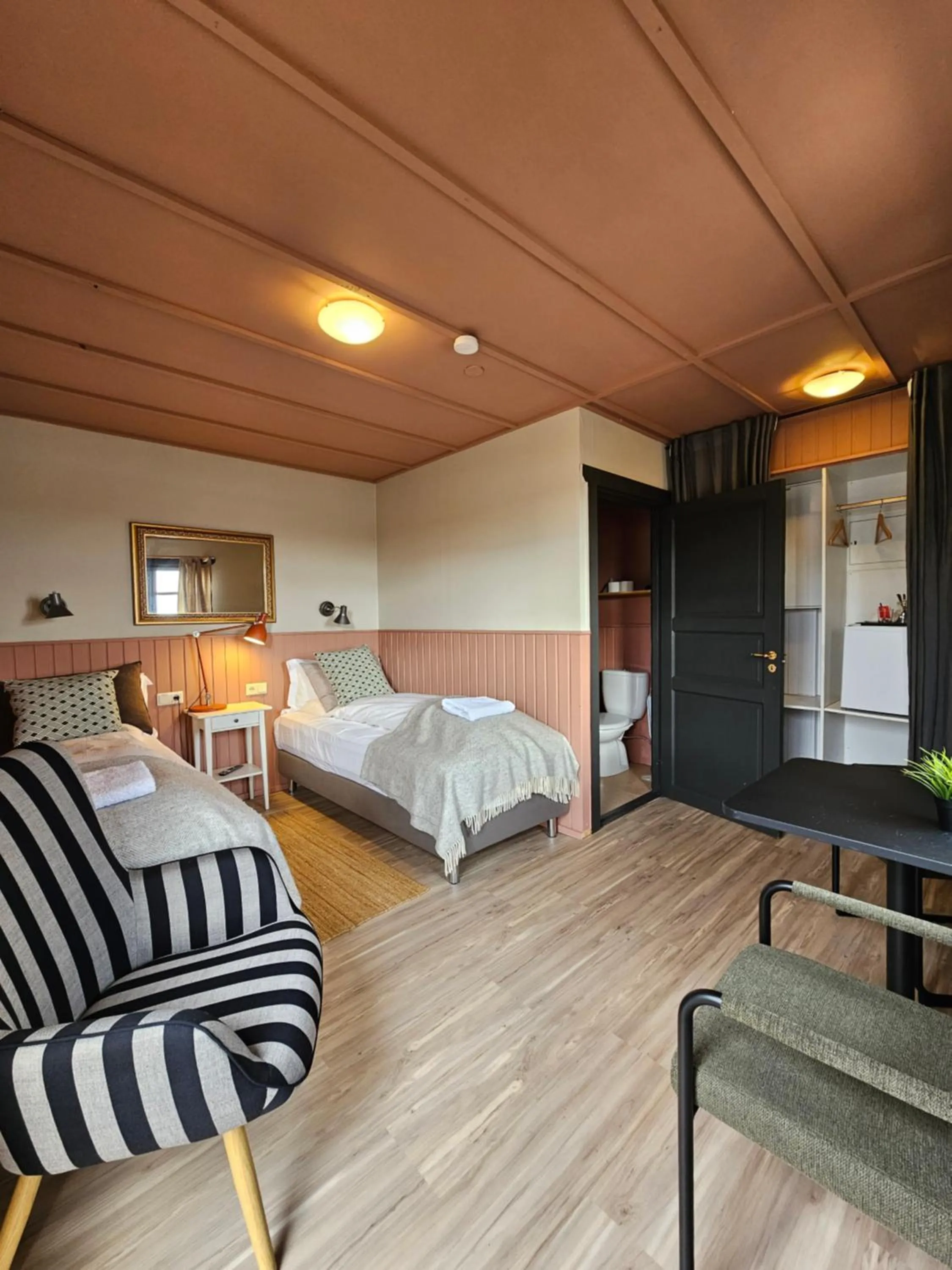 Bed in Riverfront Lodge Hella