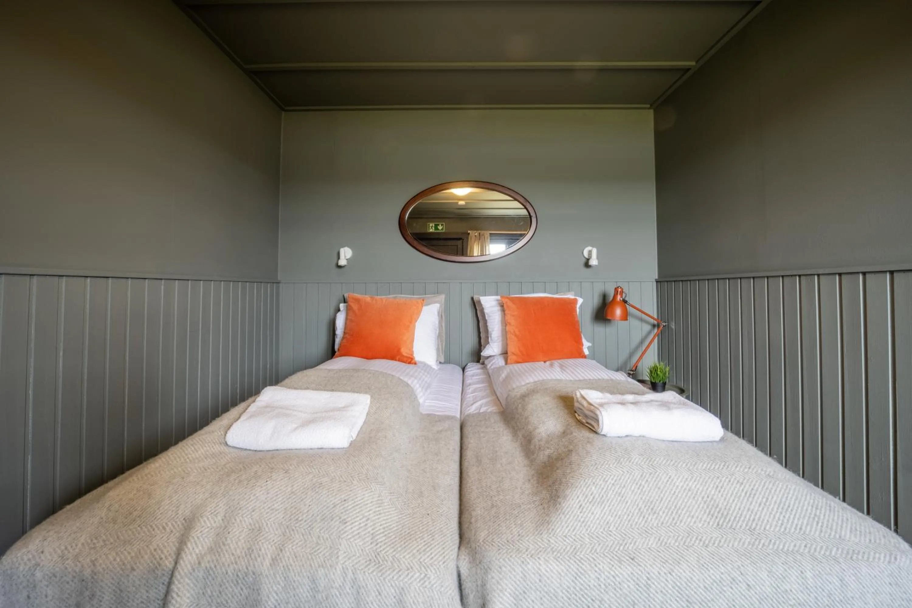 Bed in Riverfront Lodge Hella