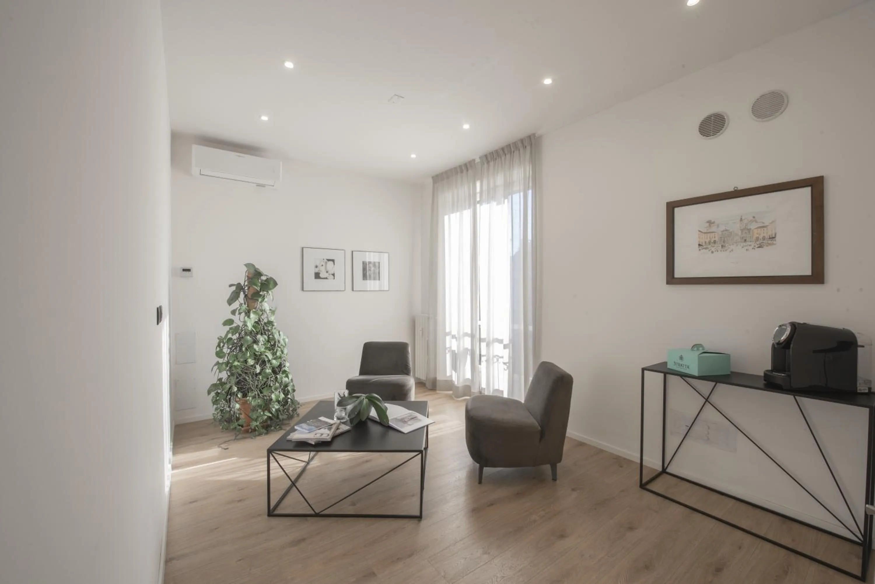 Communal lounge/ TV room in San Carlo Suite Torino