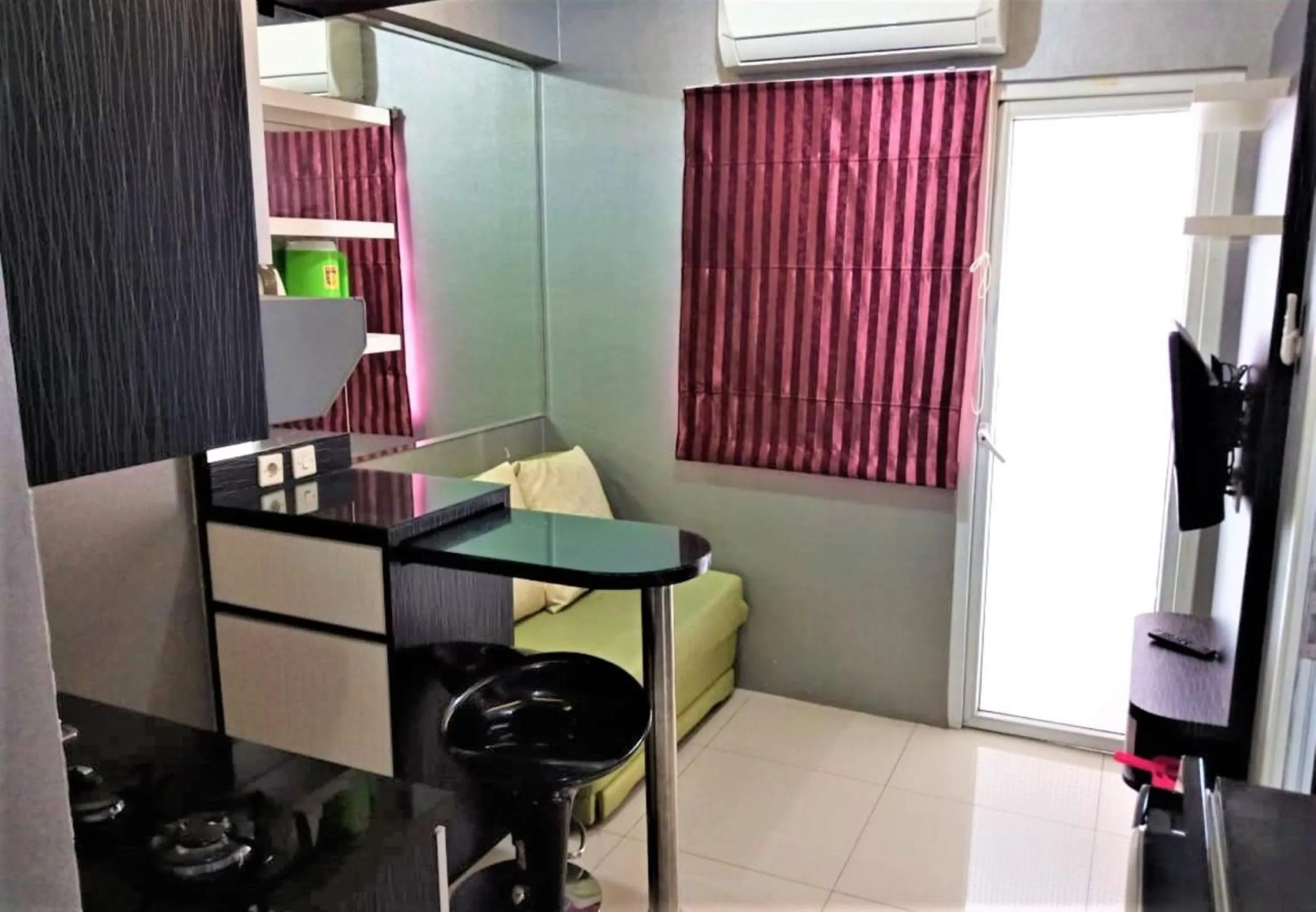 Living room in Green Pramuka Apartement By Vici