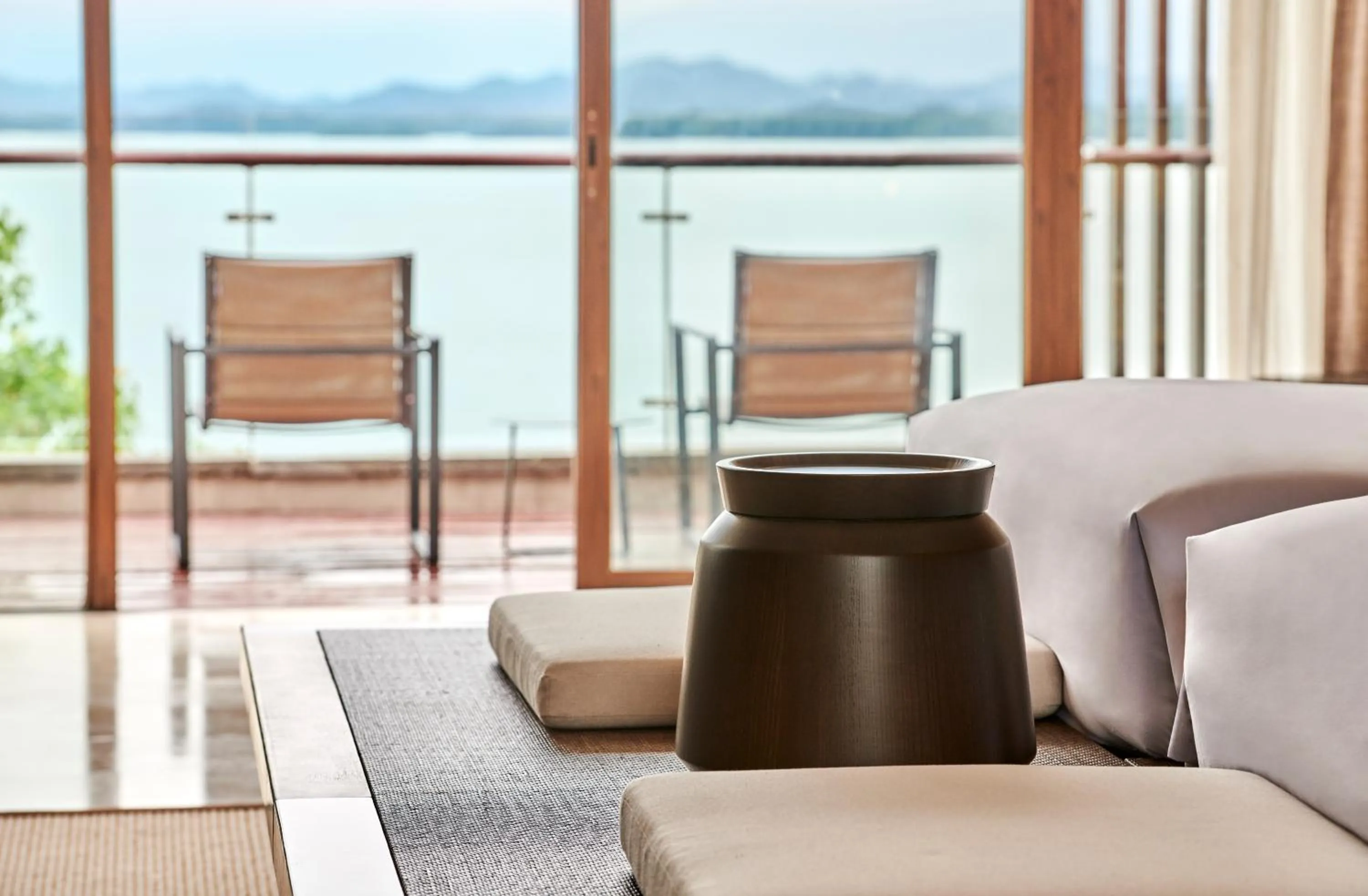 Seating area in Lushan West Sea Resort, Curio Collection by Hilton