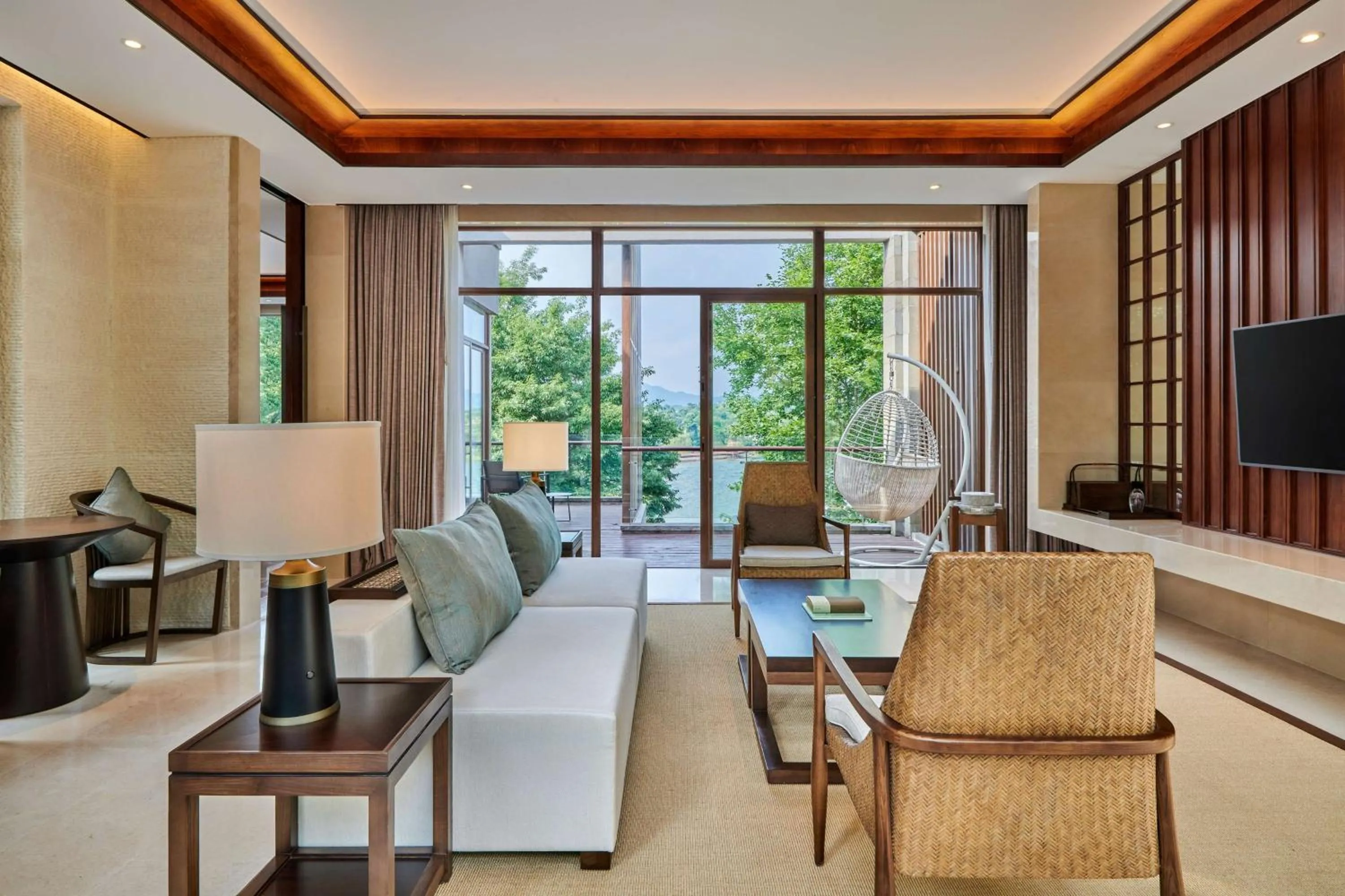 Living room in Lushan West Sea Resort, Curio Collection by Hilton