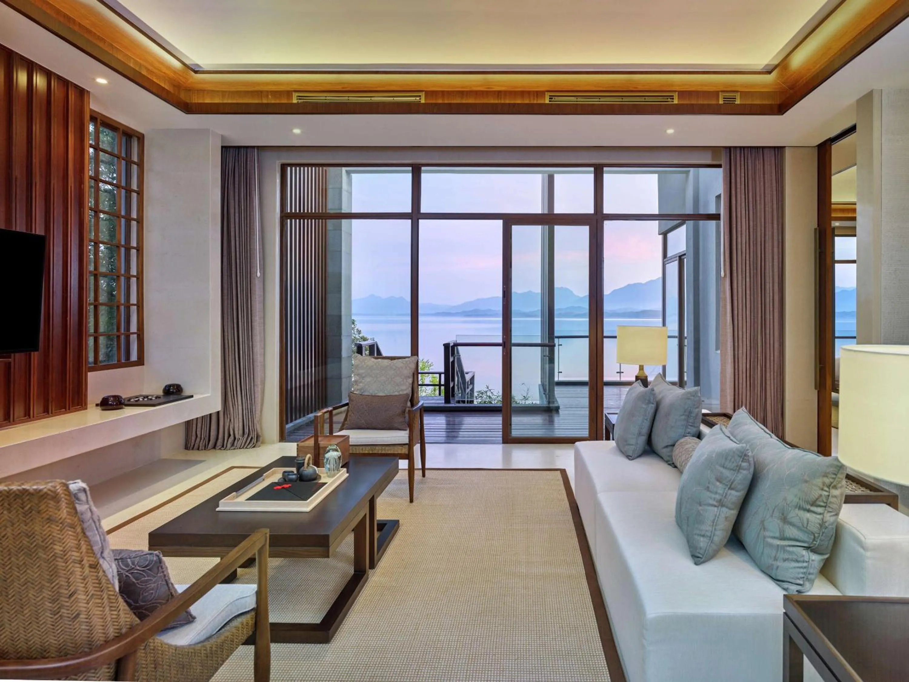 Living room in Lushan West Sea Resort, Curio Collection by Hilton