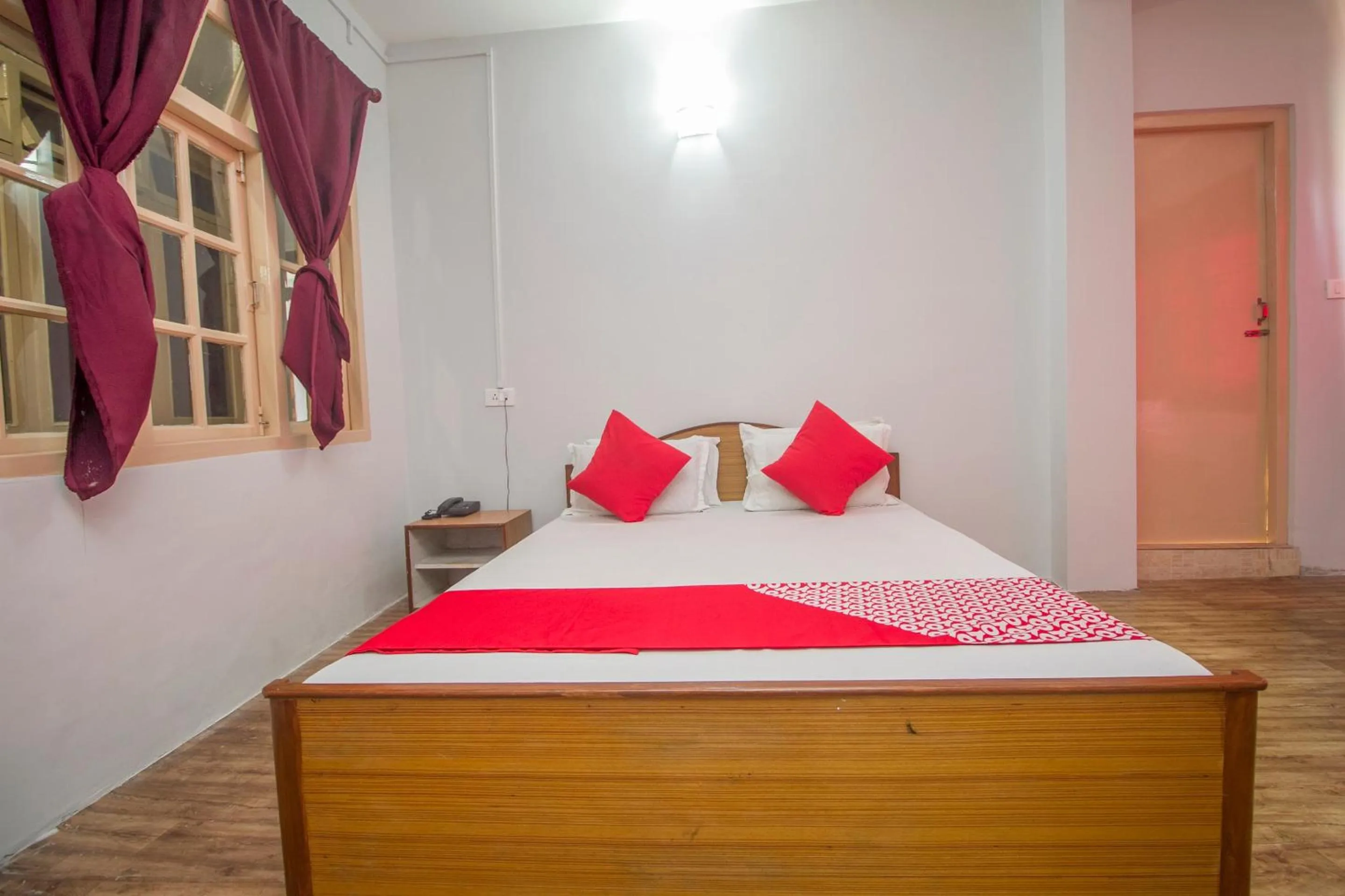 Bedroom in Hotel O Nourpem Residency