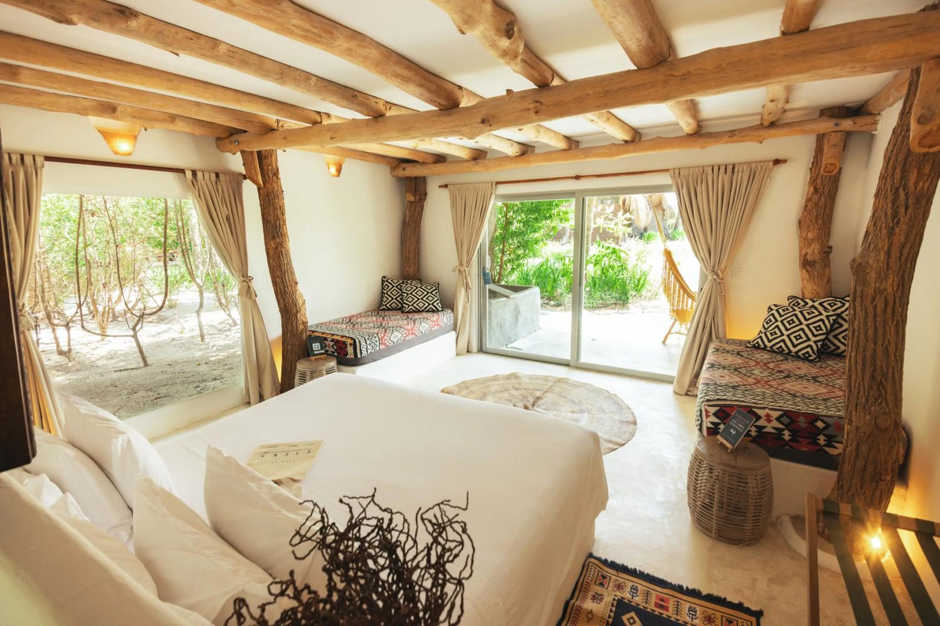 Bed in Éteka Slow Beach Hotel Adults Only