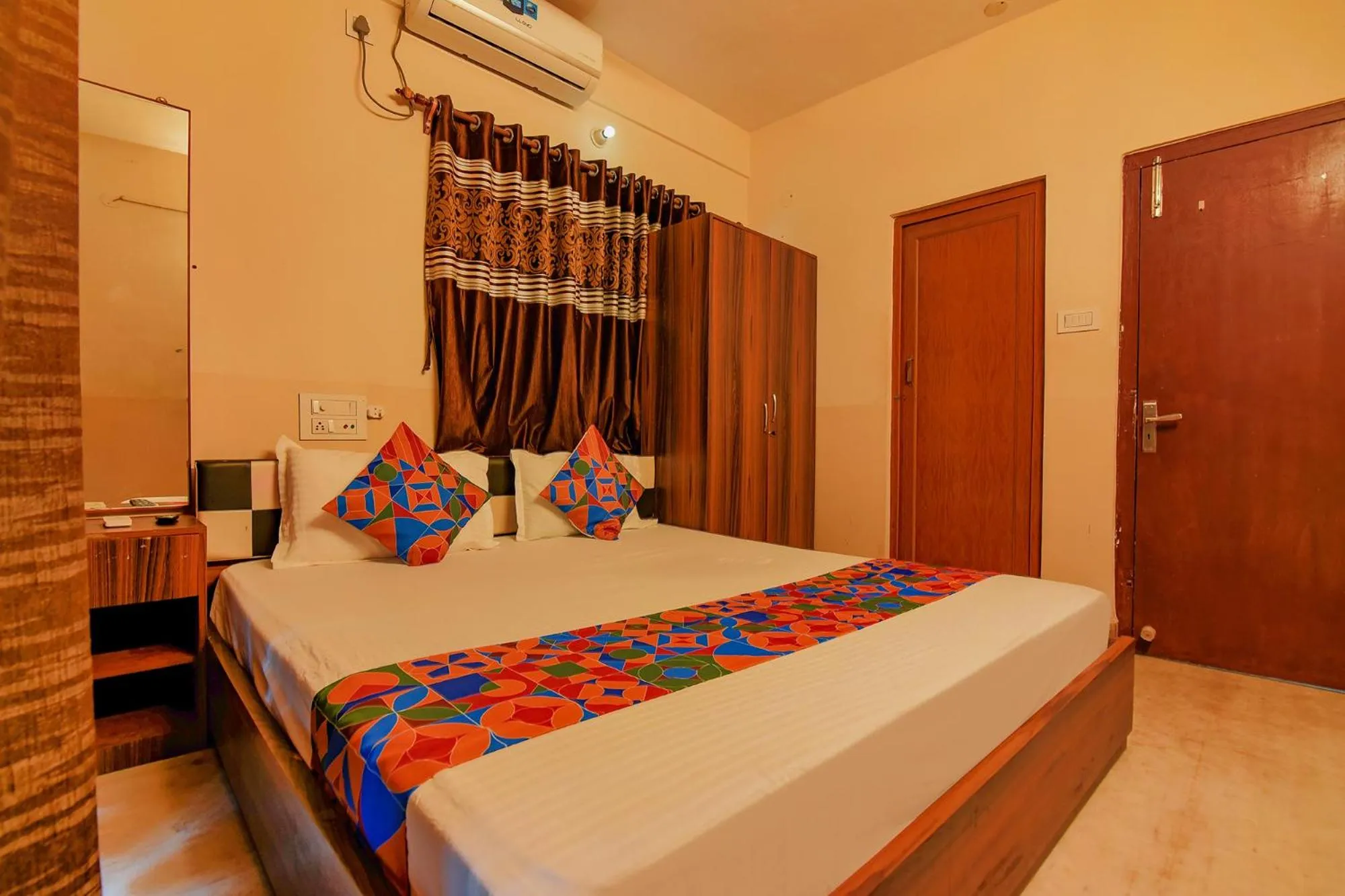 Bed in FabHotel Yatika Residency