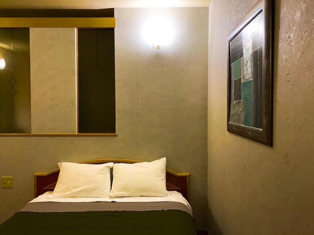 Photo of the whole room, Bed in Hotel bin