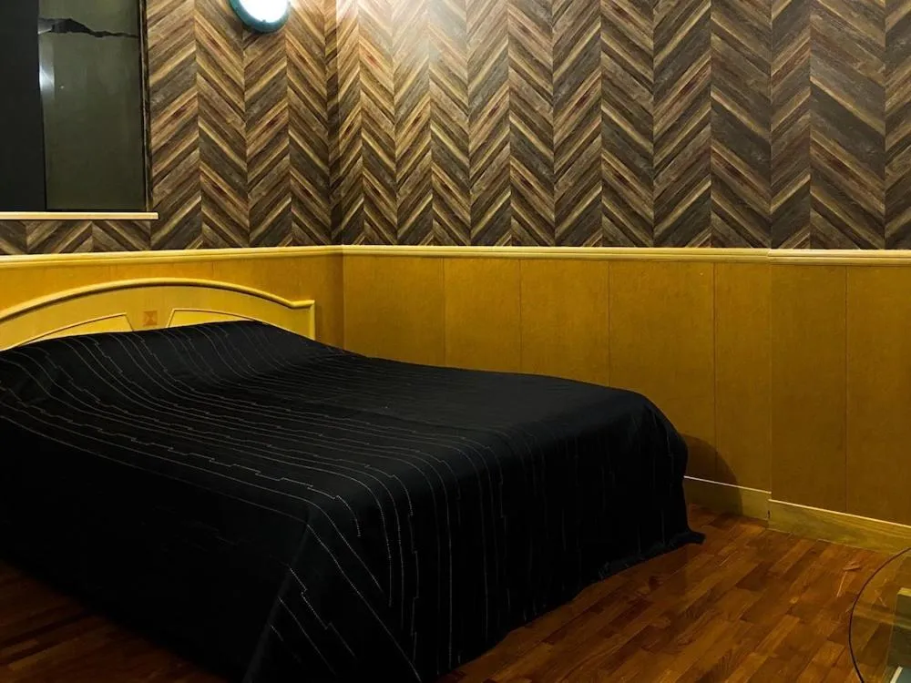 Photo of the whole room, Bed in Hotel bin