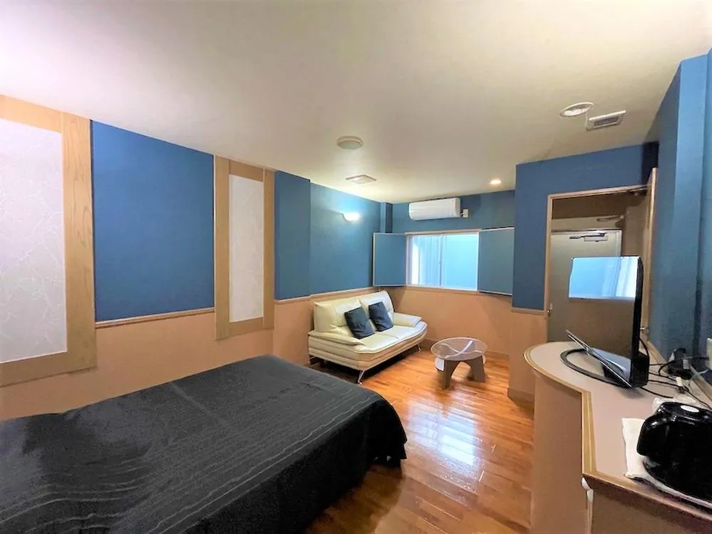 Photo of the whole room, Bed in Hotel bin