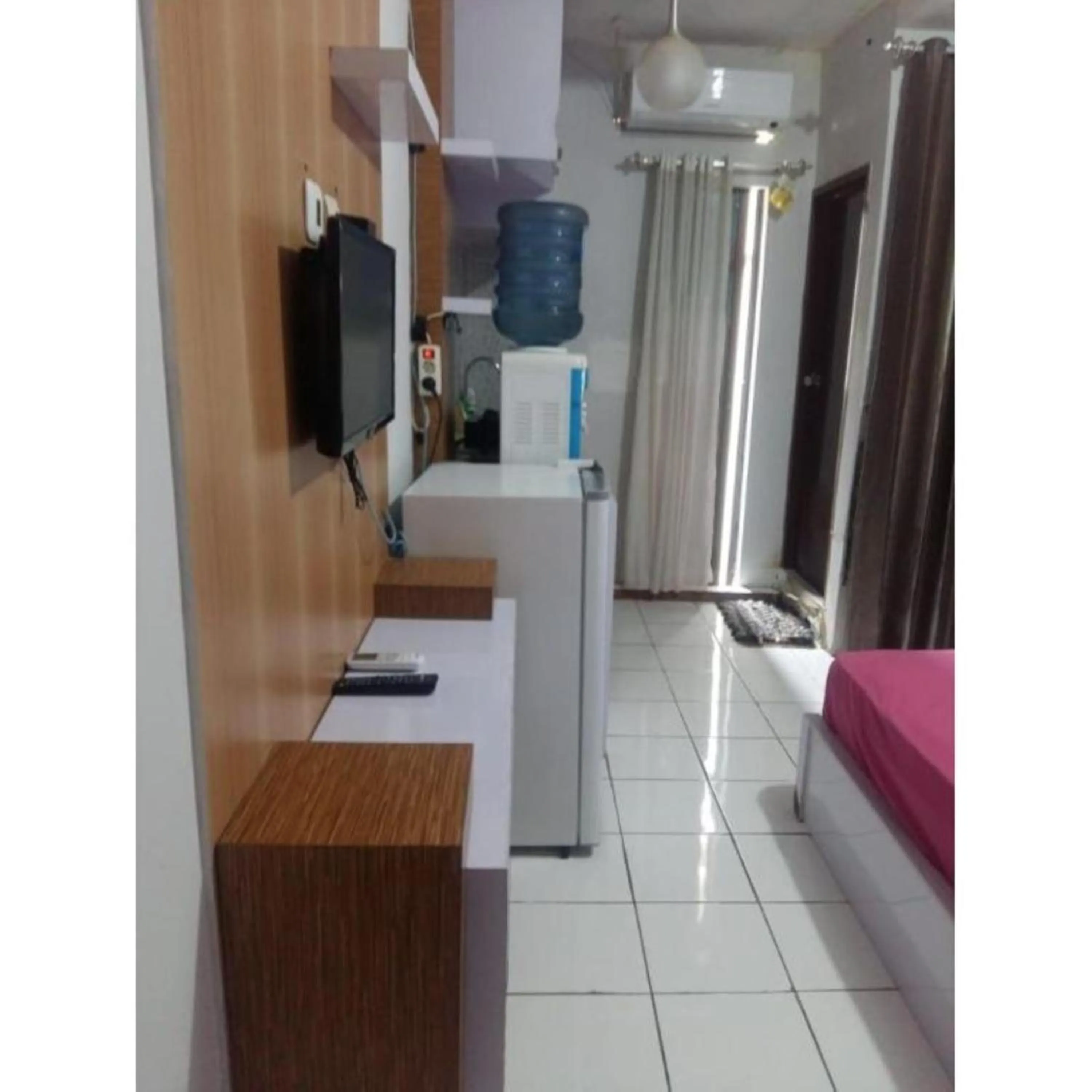 TV and multimedia in Gateway Apartment Cicadas by DB Property