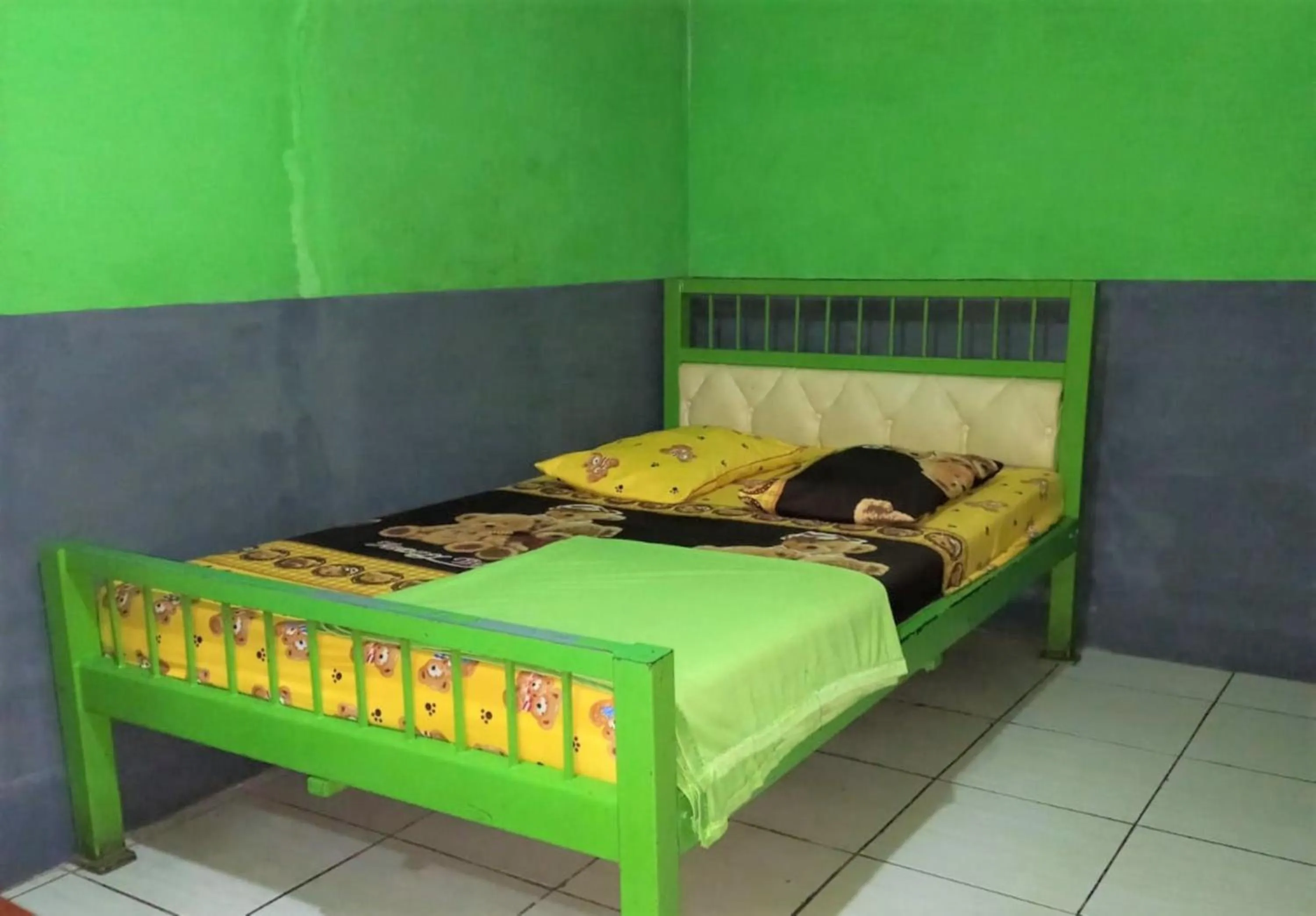 Bed in Penginapan 99
