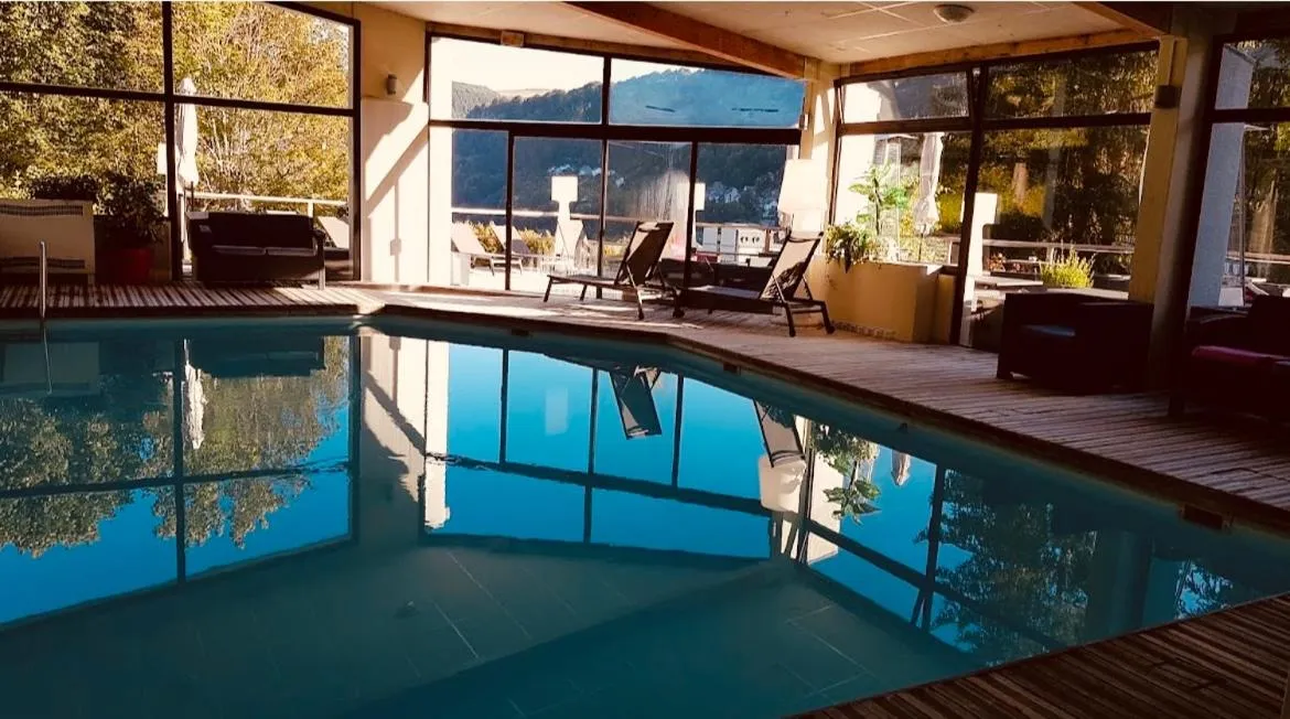 Swimming pool in The Originals Boutique Hotel Le Panorama Mont Dore