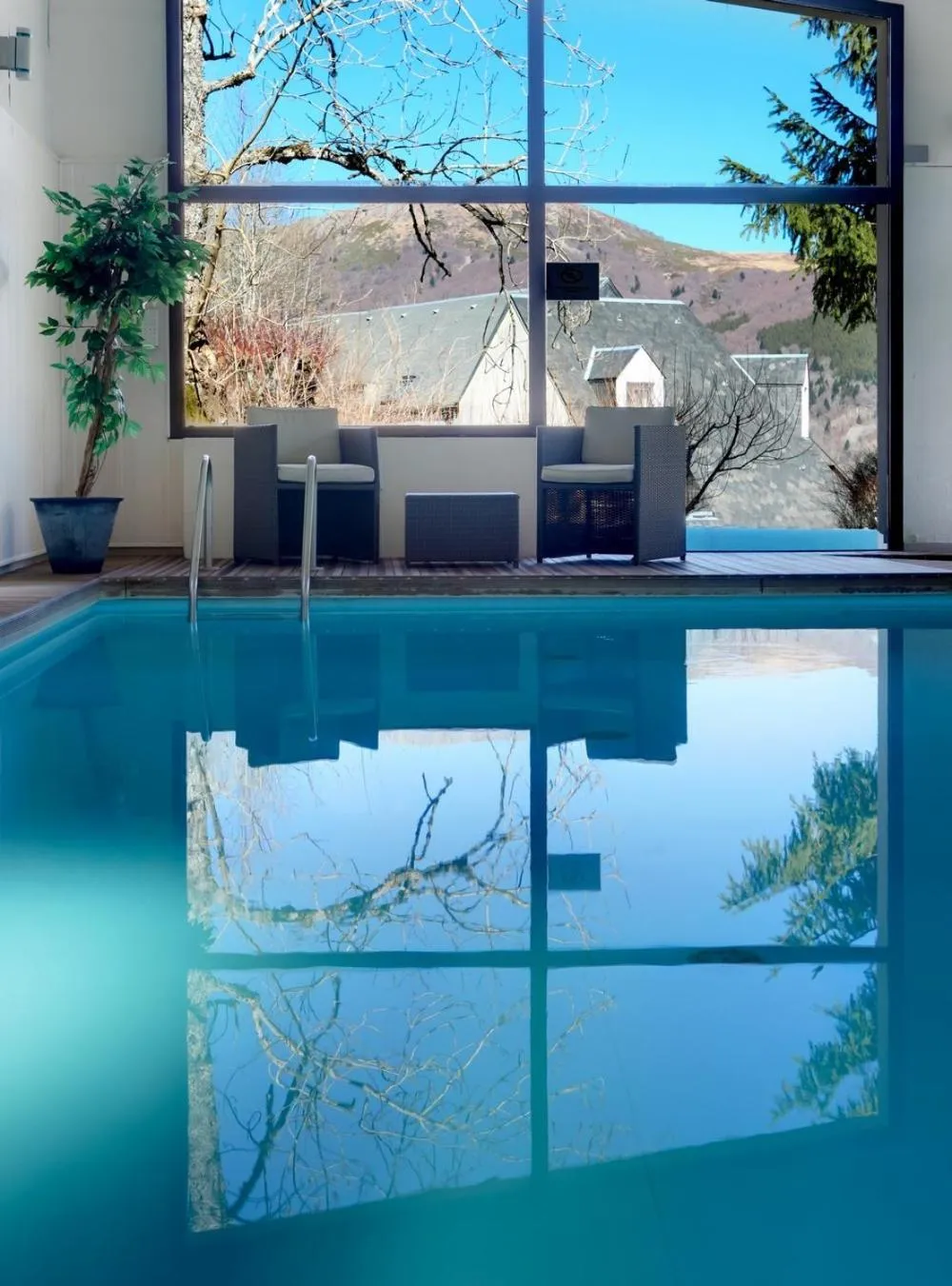 Swimming pool in The Originals Boutique Hotel Le Panorama Mont Dore
