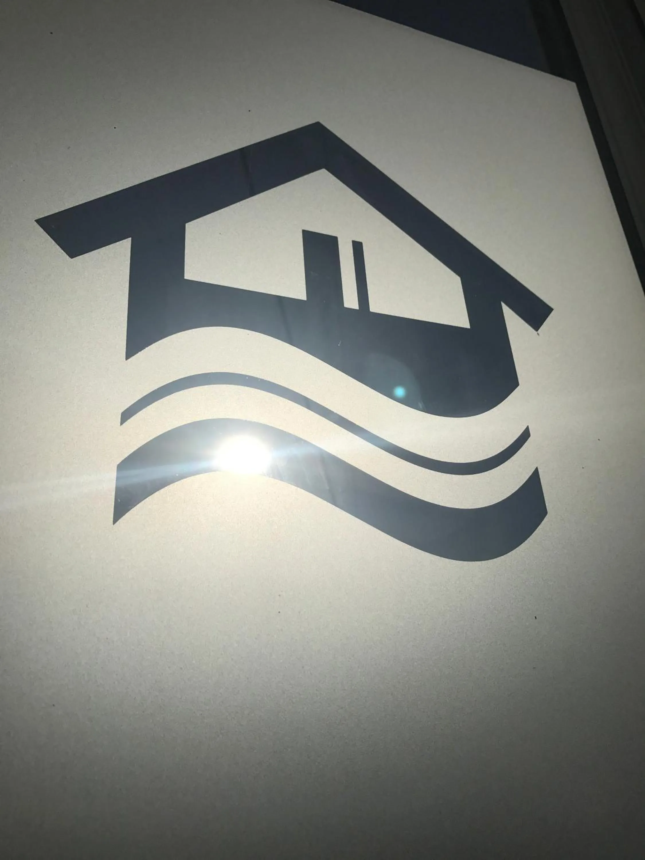 Property logo or sign in Beach Front Guest House
