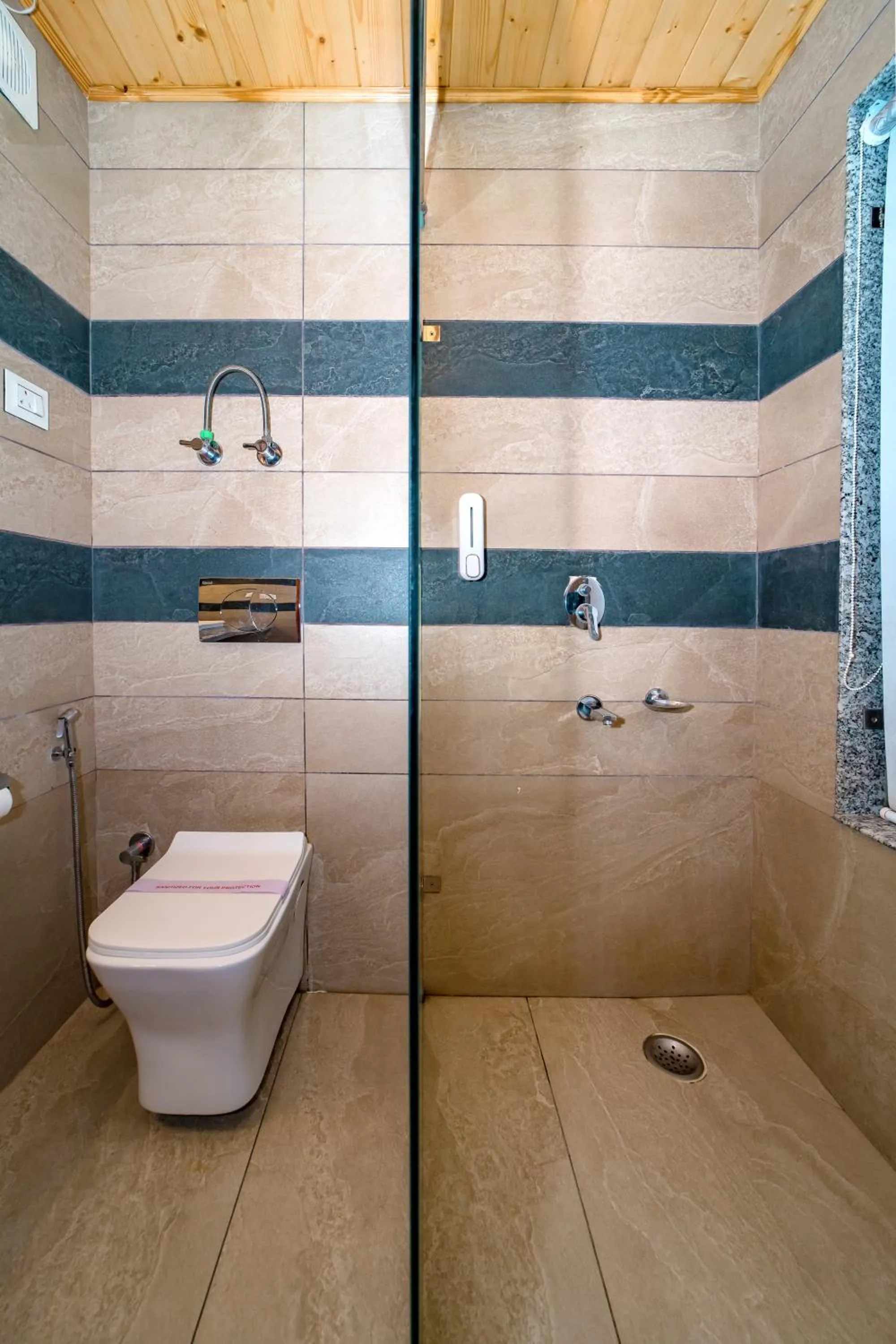 Shower in Snow City's Montana Blues Resort Manali - Heated & Air-Cooled Stay