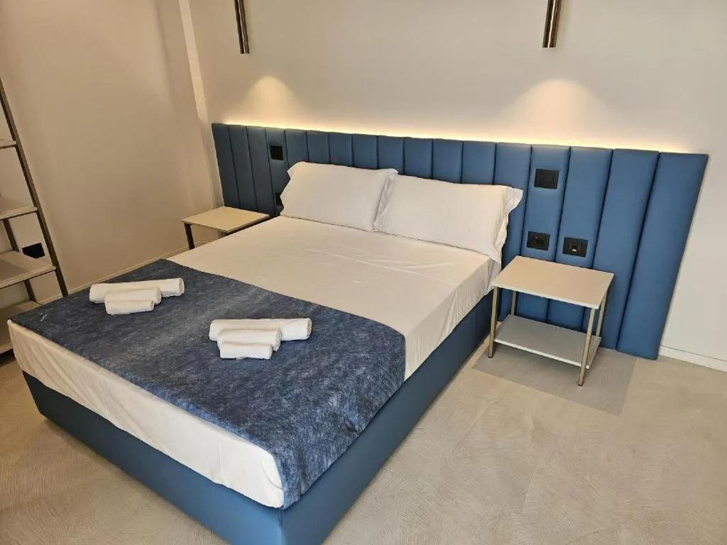 Bed in Gabbiano Suites