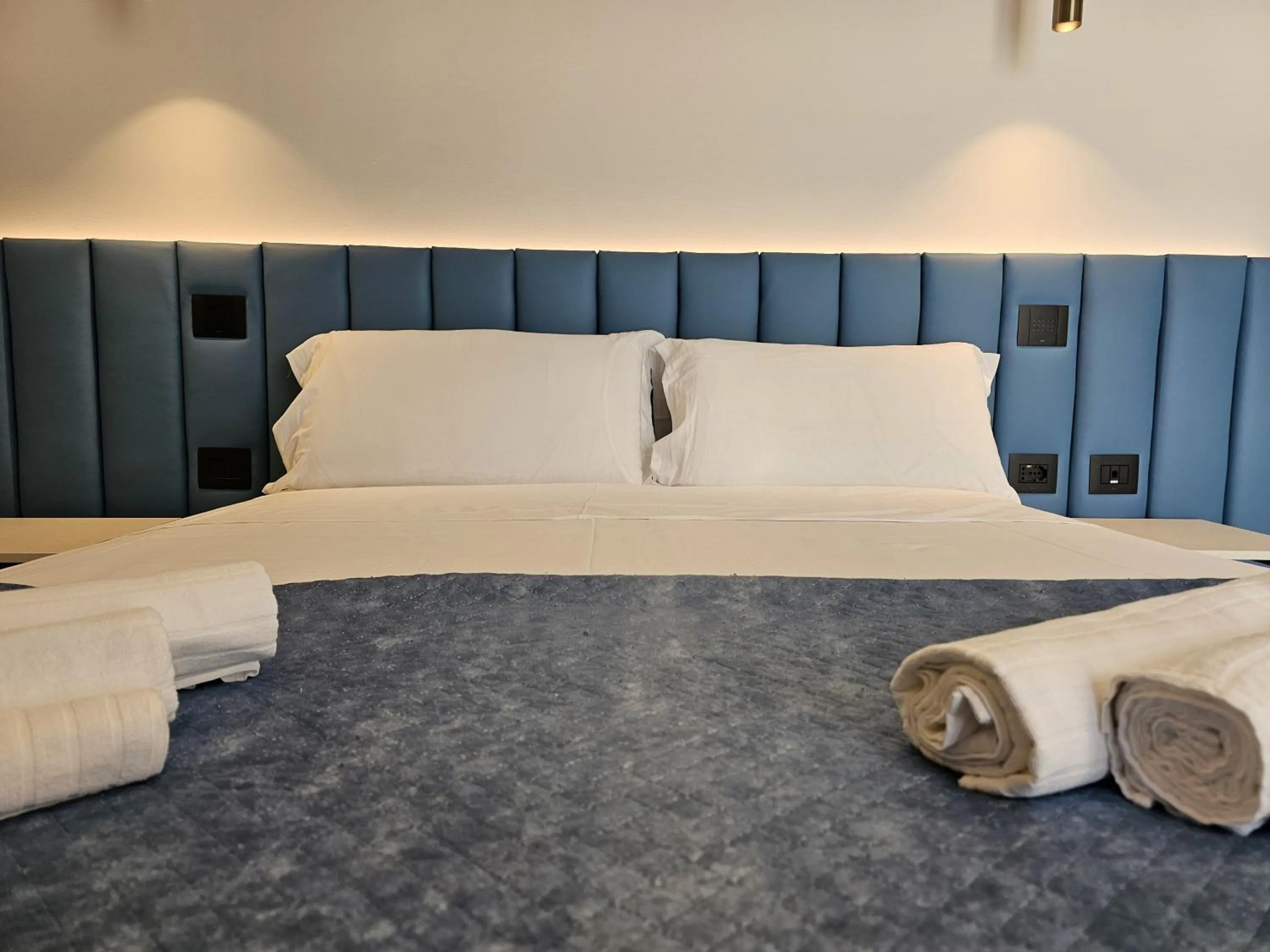 Bed in Gabbiano Suites