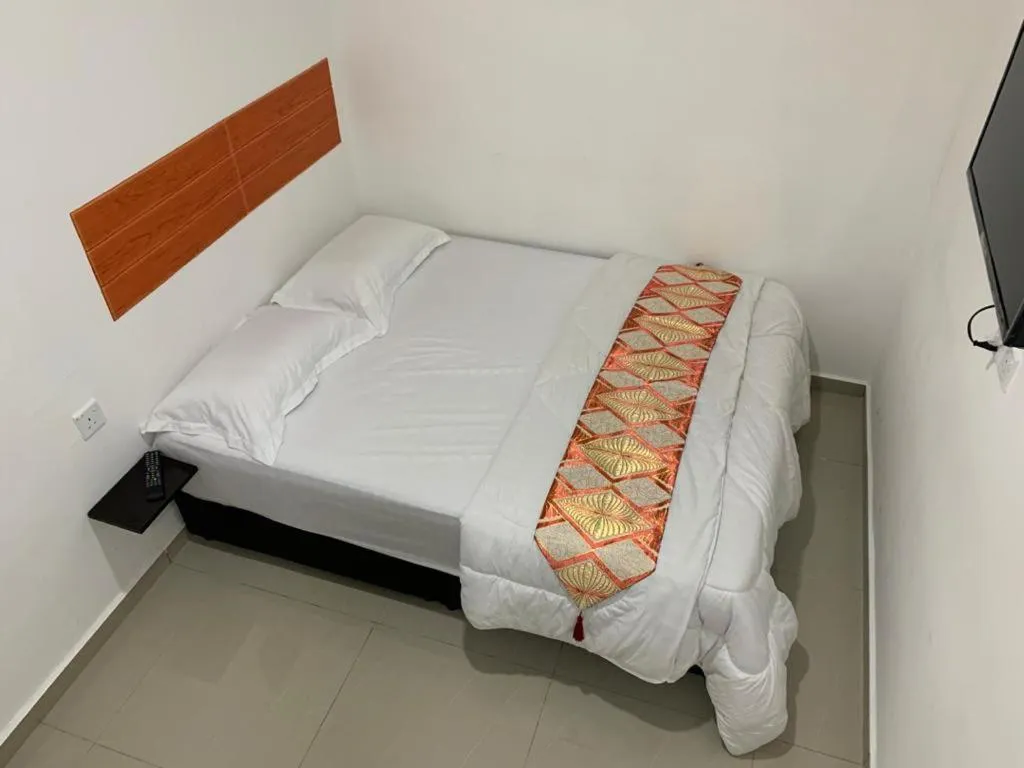 Bed in Orange Villa Hotel Near Palm Mall Seremban