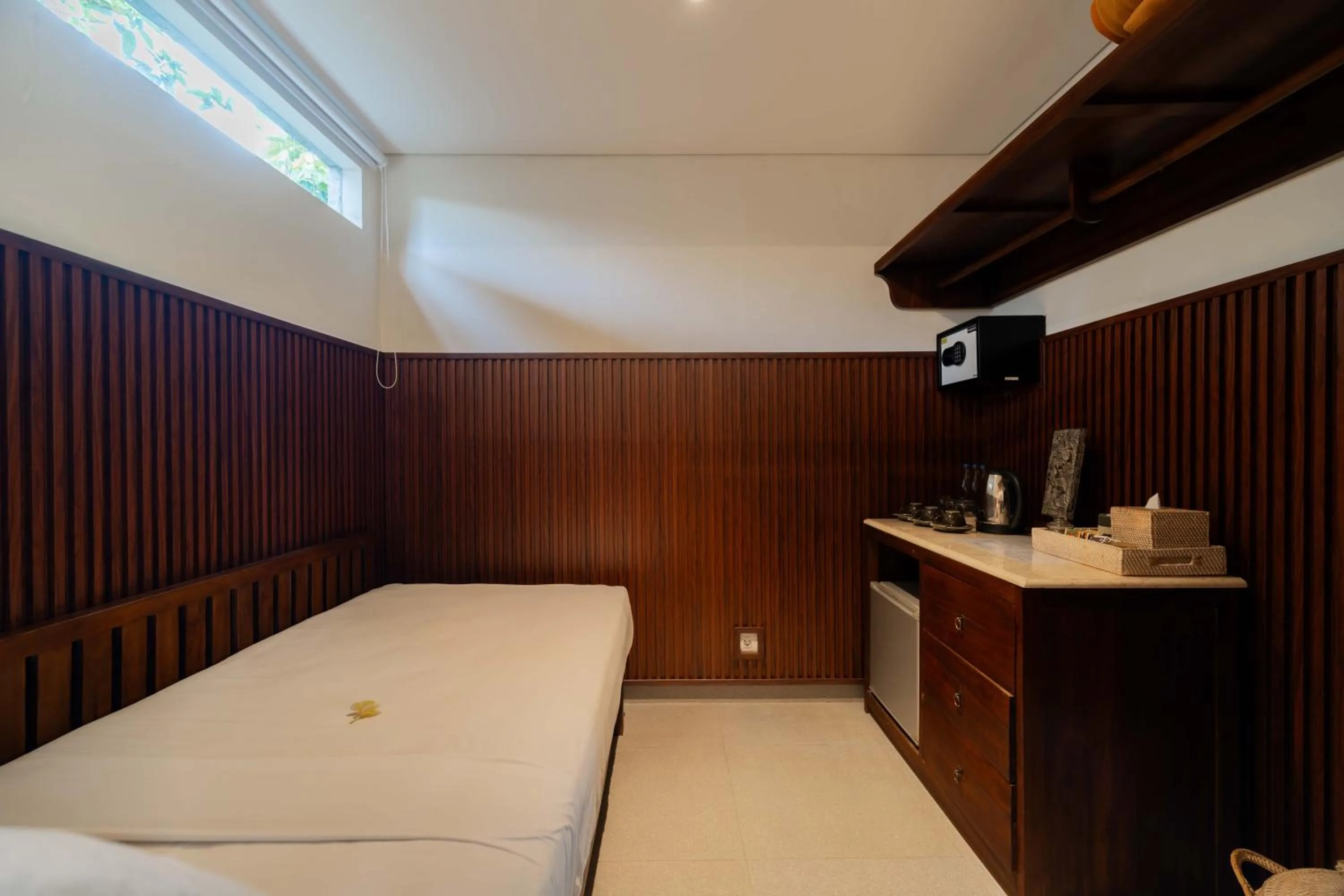 Bed in Sama's Cottages and Villas