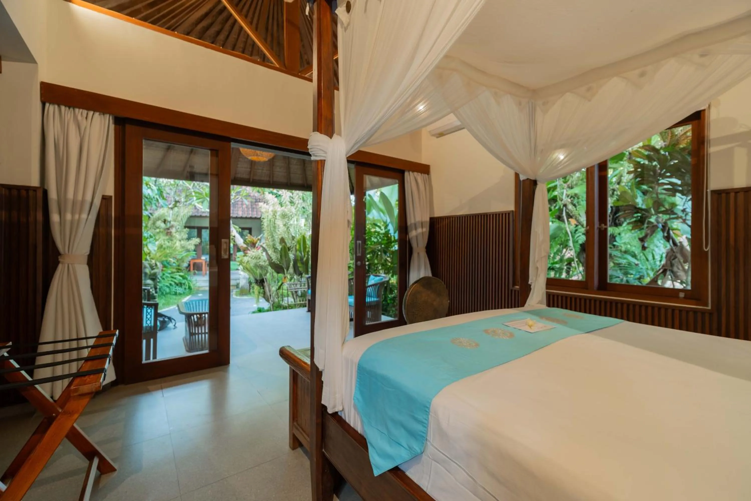 Bed in Sama's Cottages and Villas