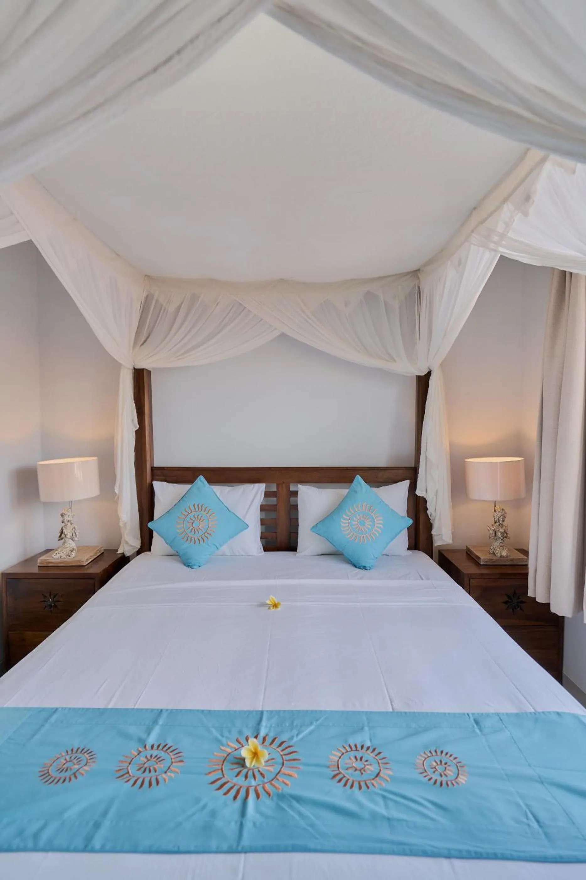 Bed in Sama's Cottages and Villas