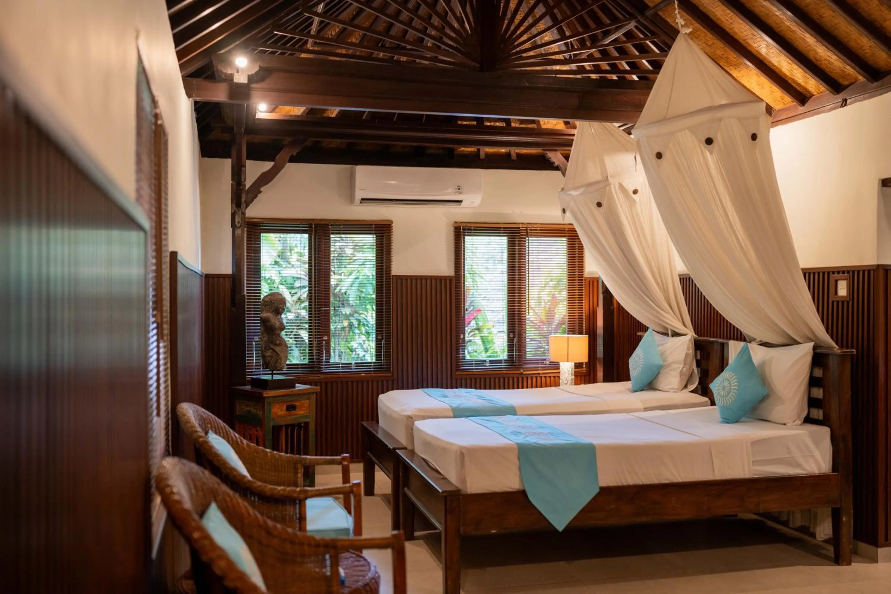 Bed in Sama's Cottages and Villas