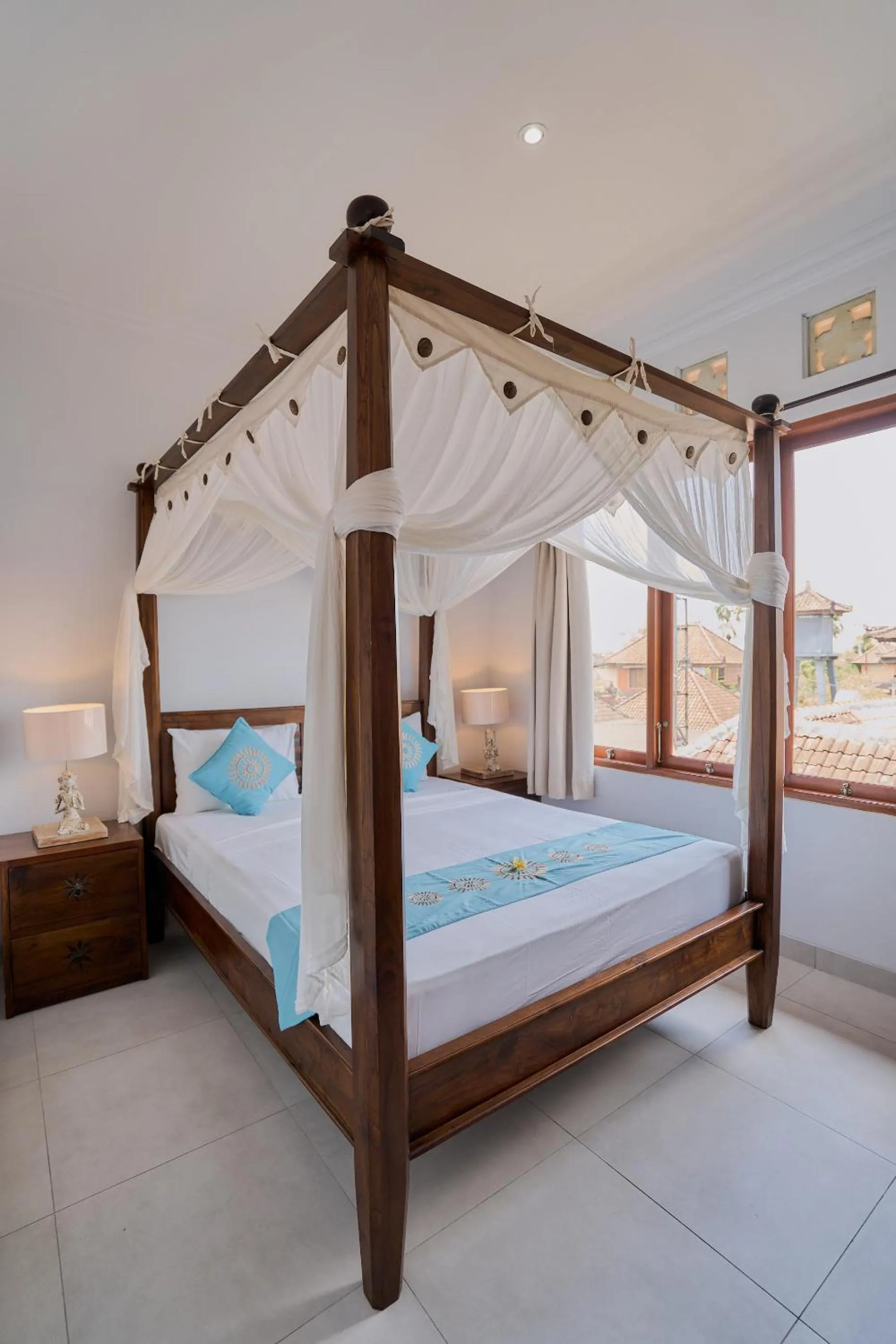 Bed in Sama's Cottages and Villas