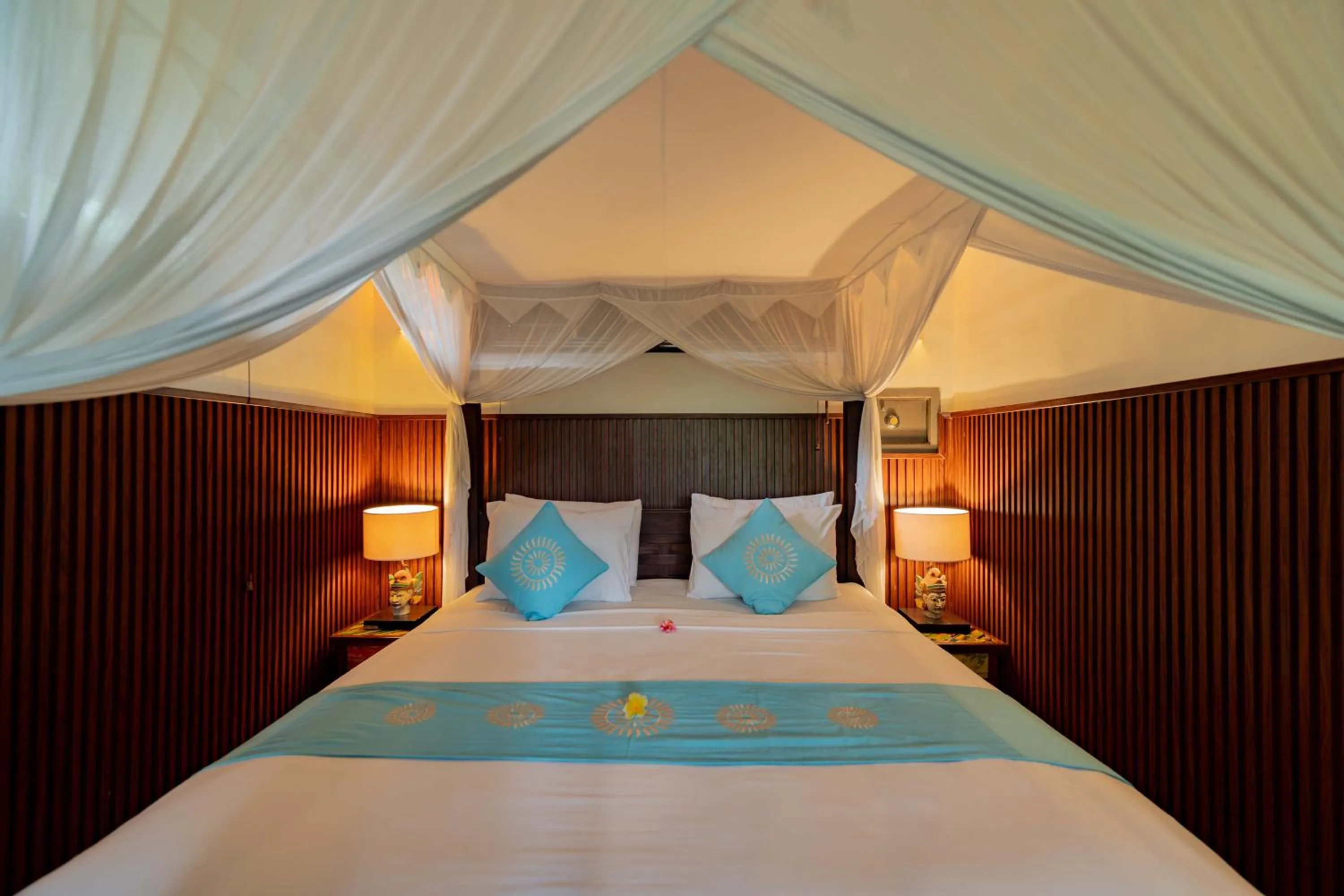 Bed in Sama's Cottages and Villas