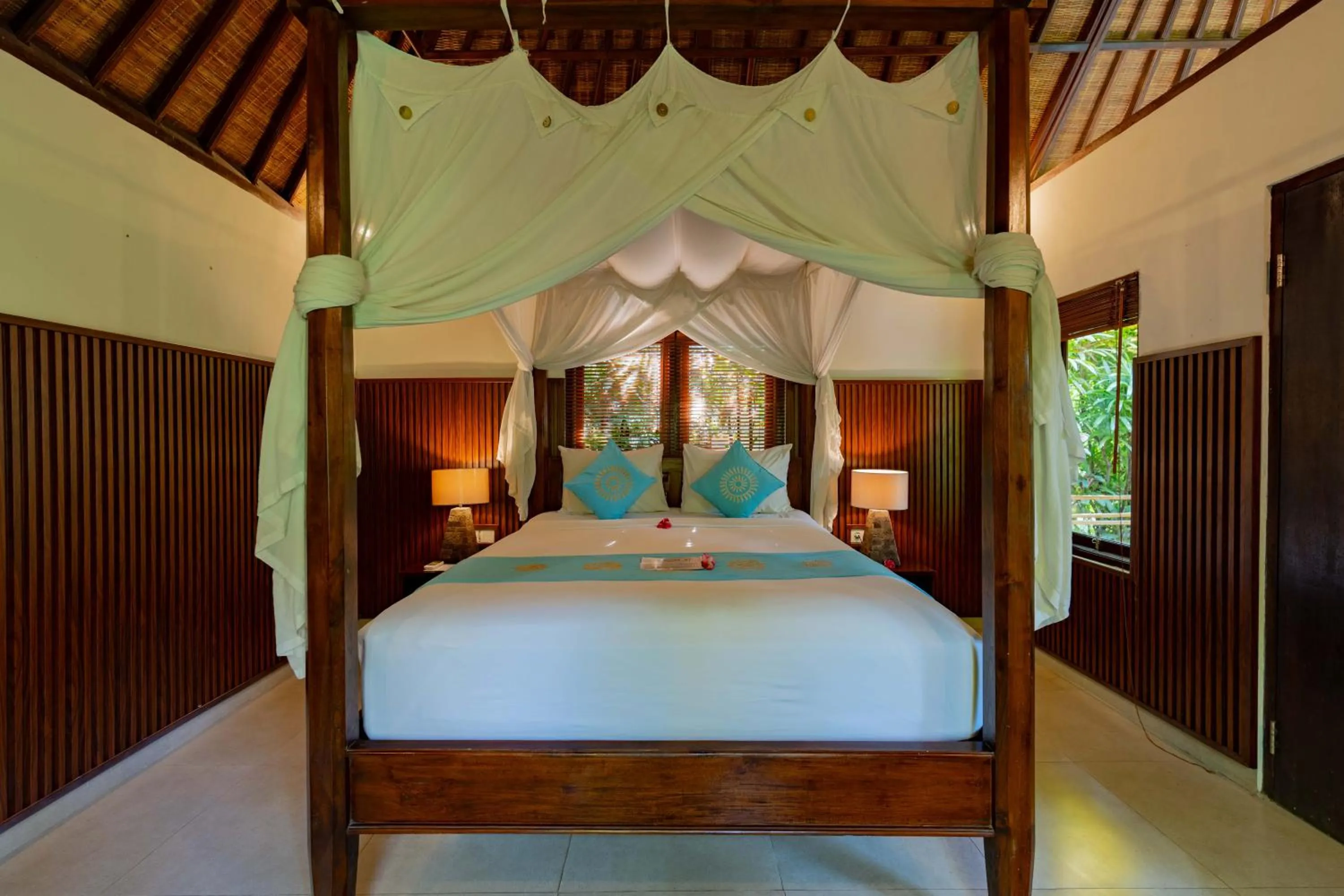 Bed in Sama's Cottages and Villas