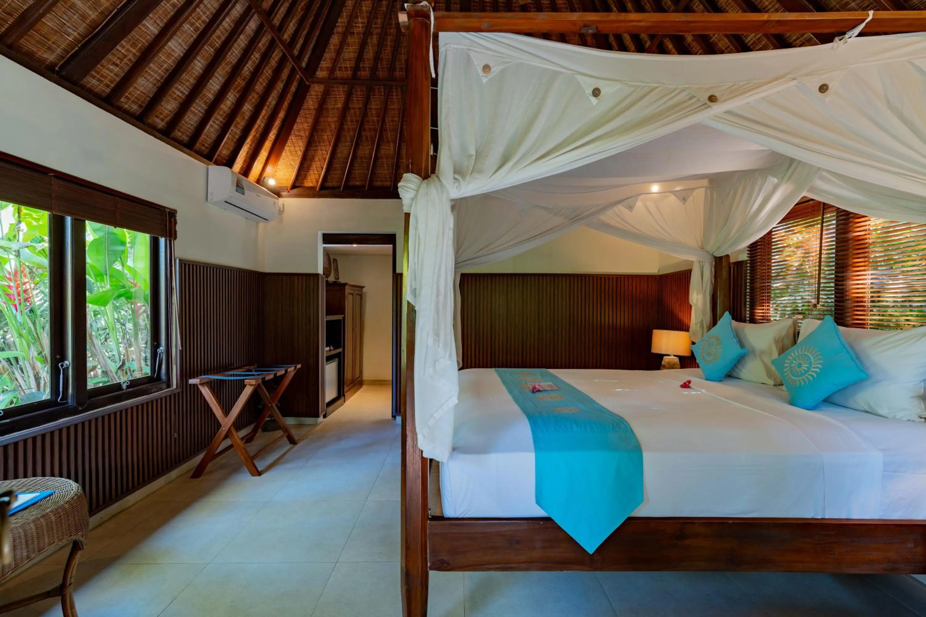 Bed in Sama's Cottages and Villas