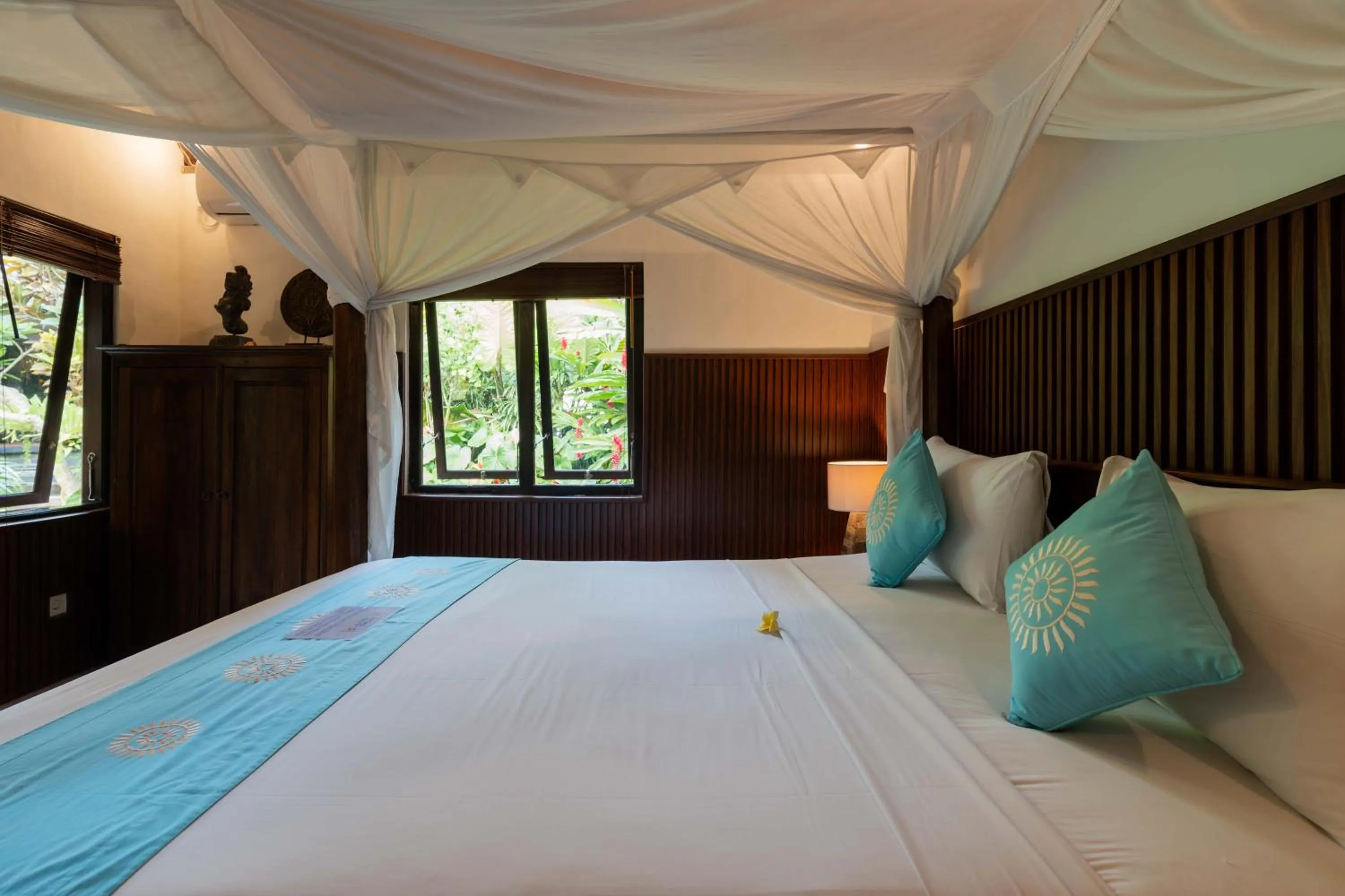 Bed in Sama's Cottages and Villas