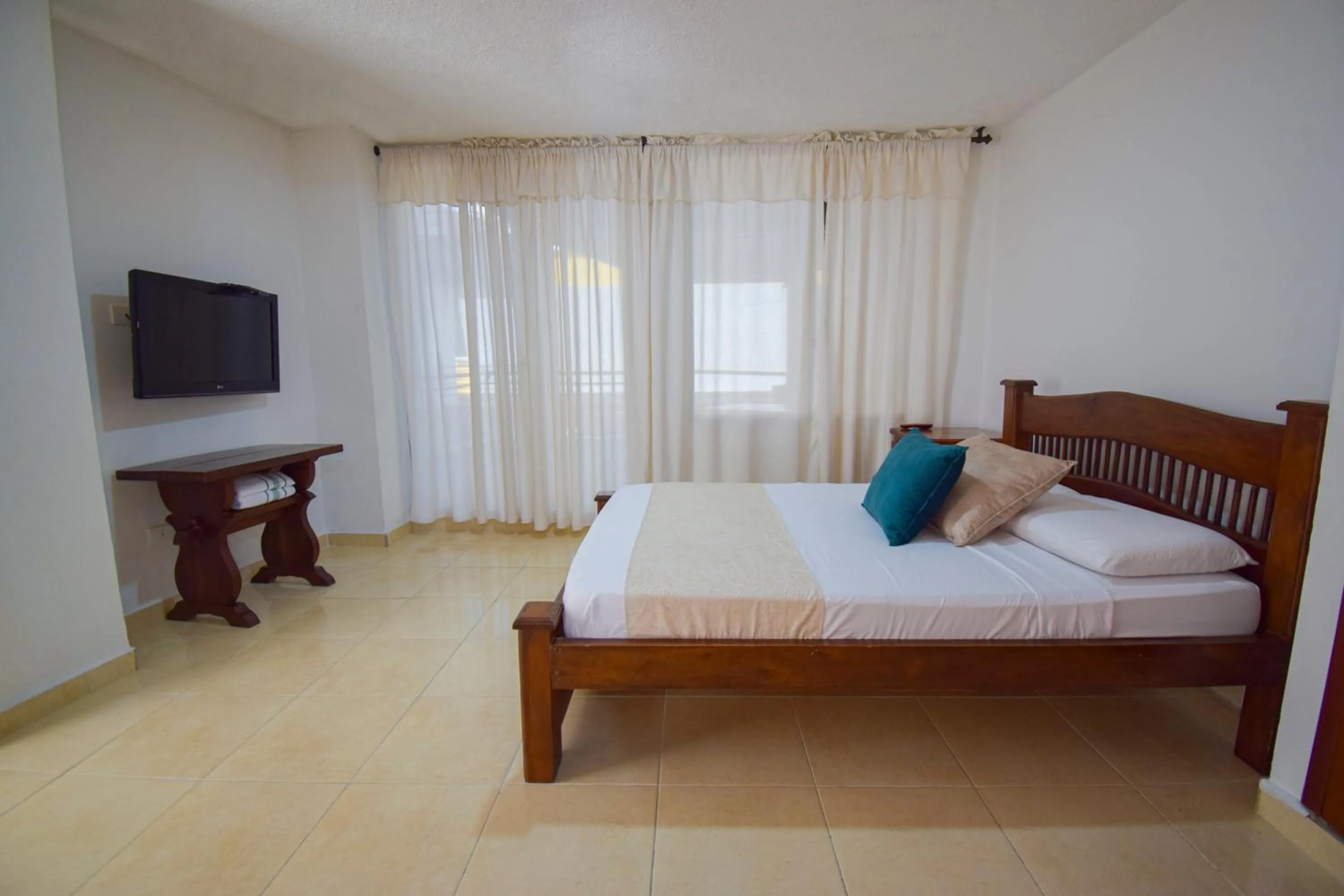 Bed in Hotel Toledo Plaza