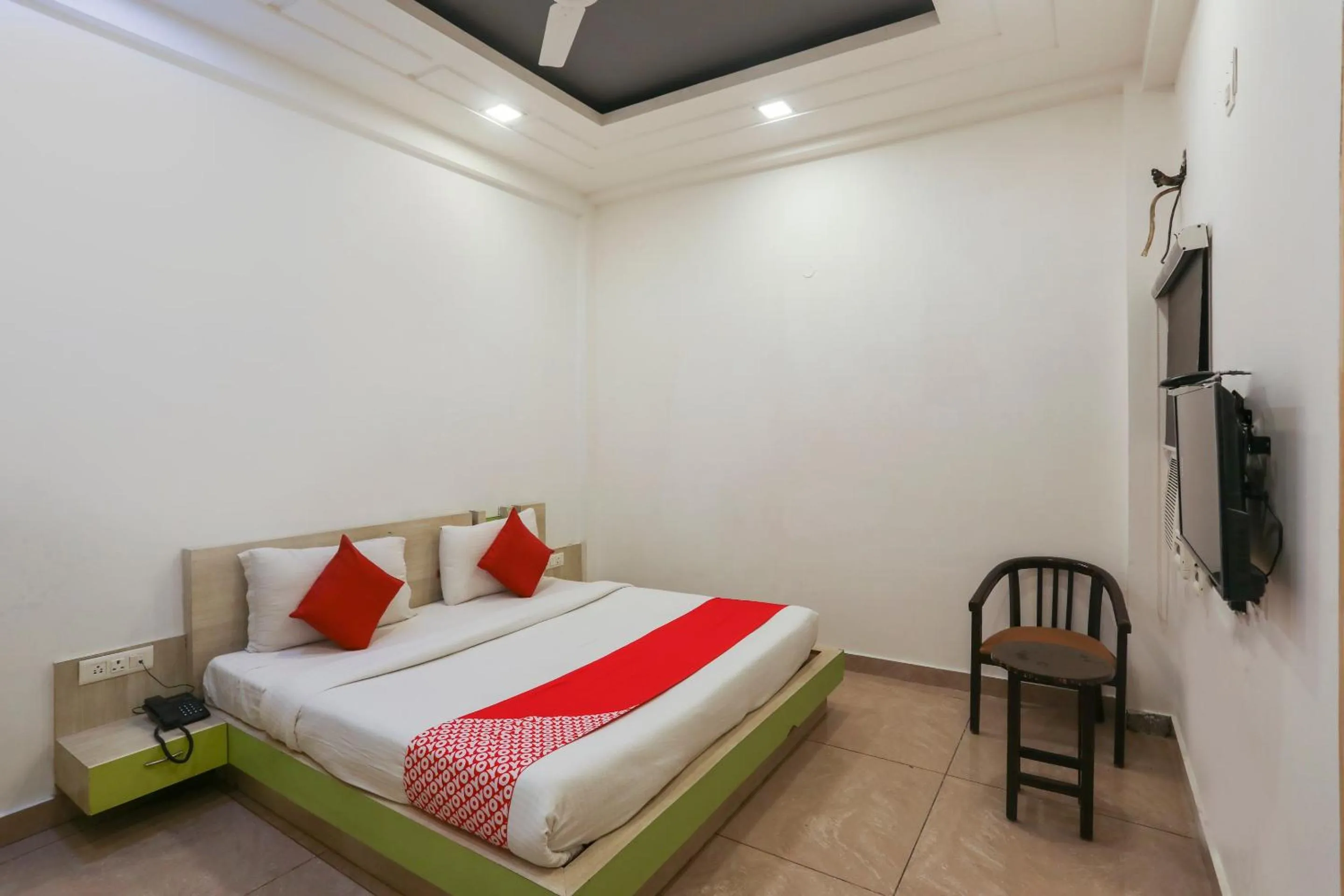 Bedroom in OYO Cladis Near Mall Of India