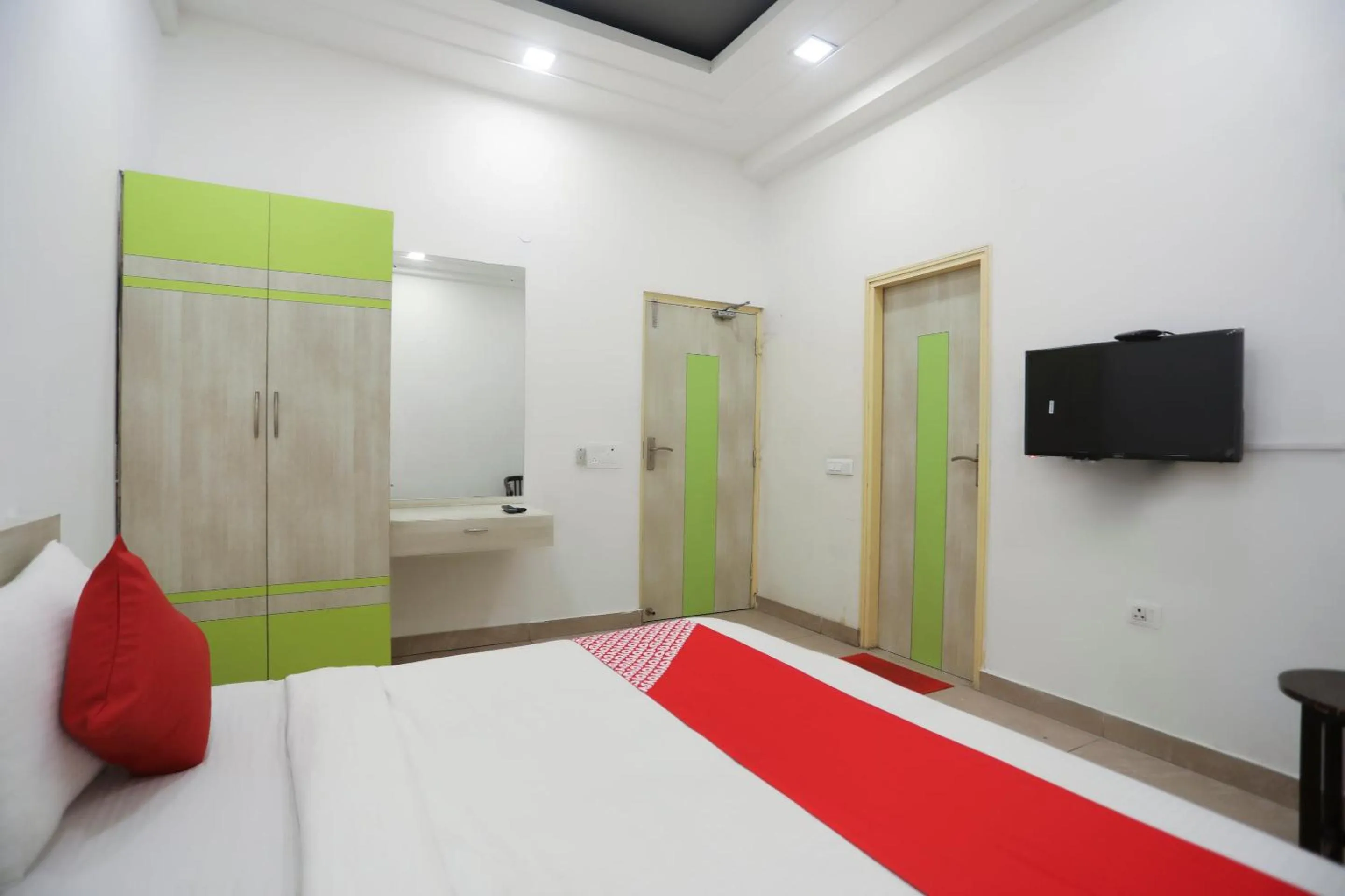 Bedroom in OYO Cladis Near Mall Of India