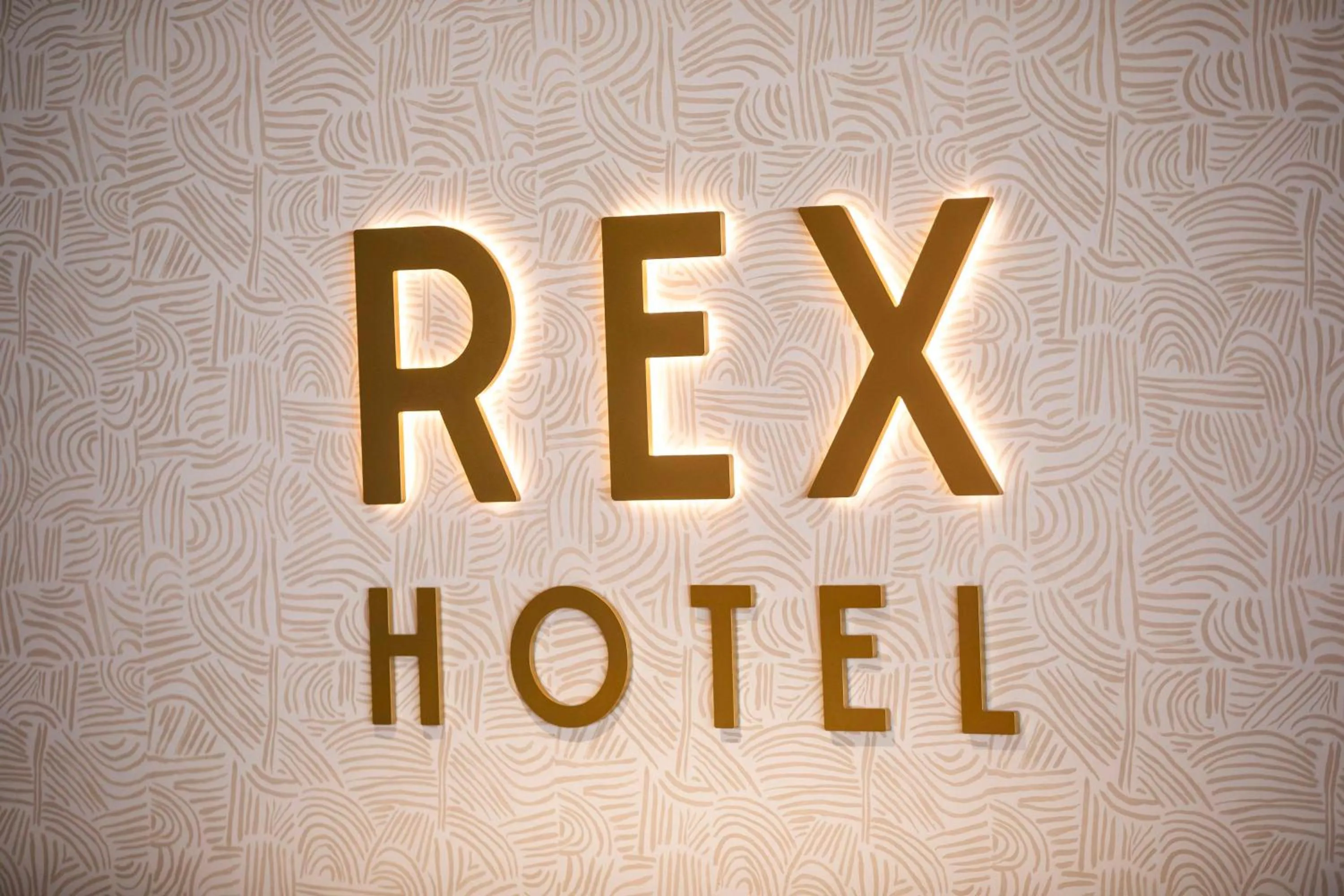 Property logo or sign in Nightcap at Rex Hotel