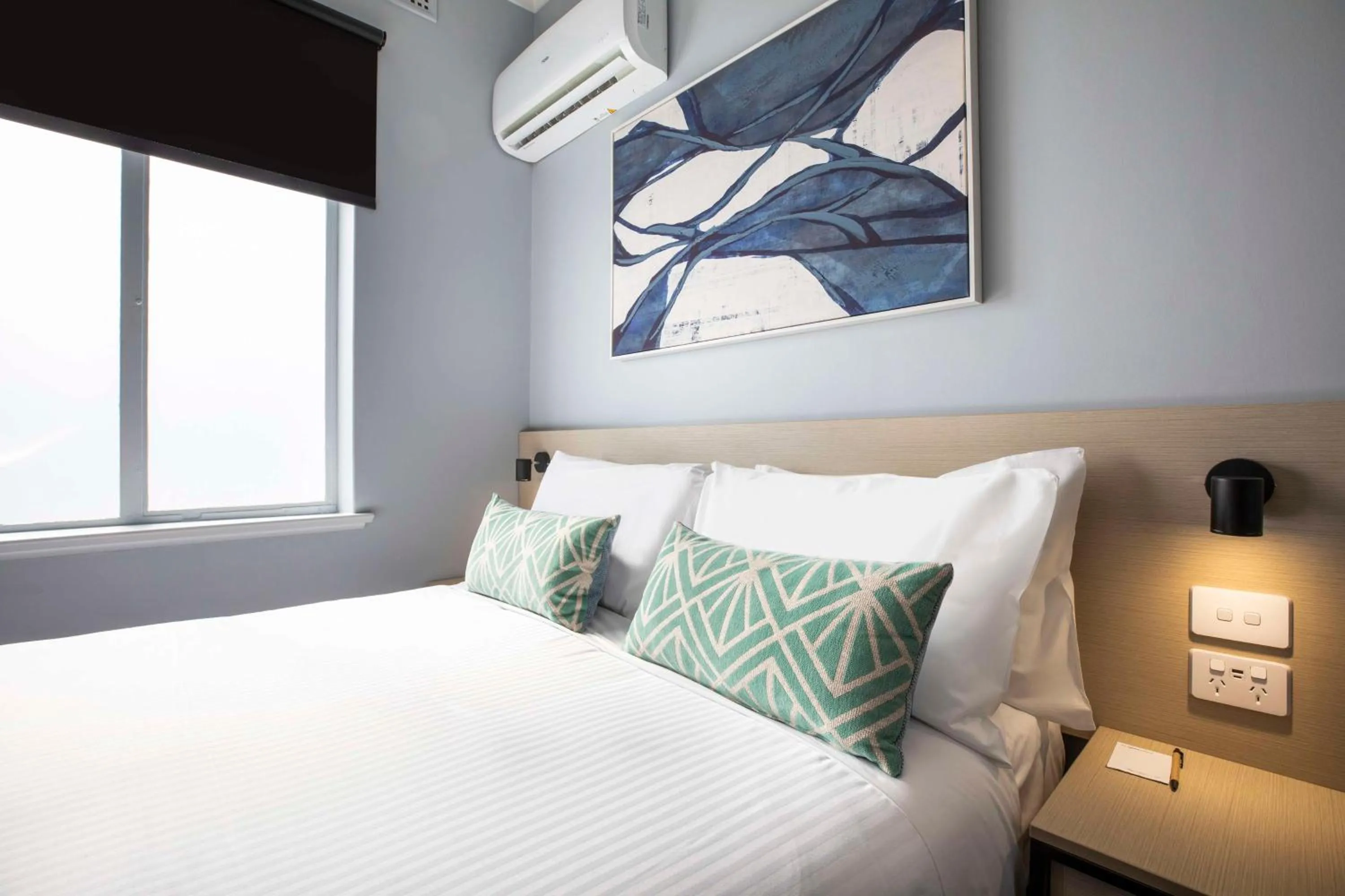 Bedroom, Bed in Nightcap at Rex Hotel