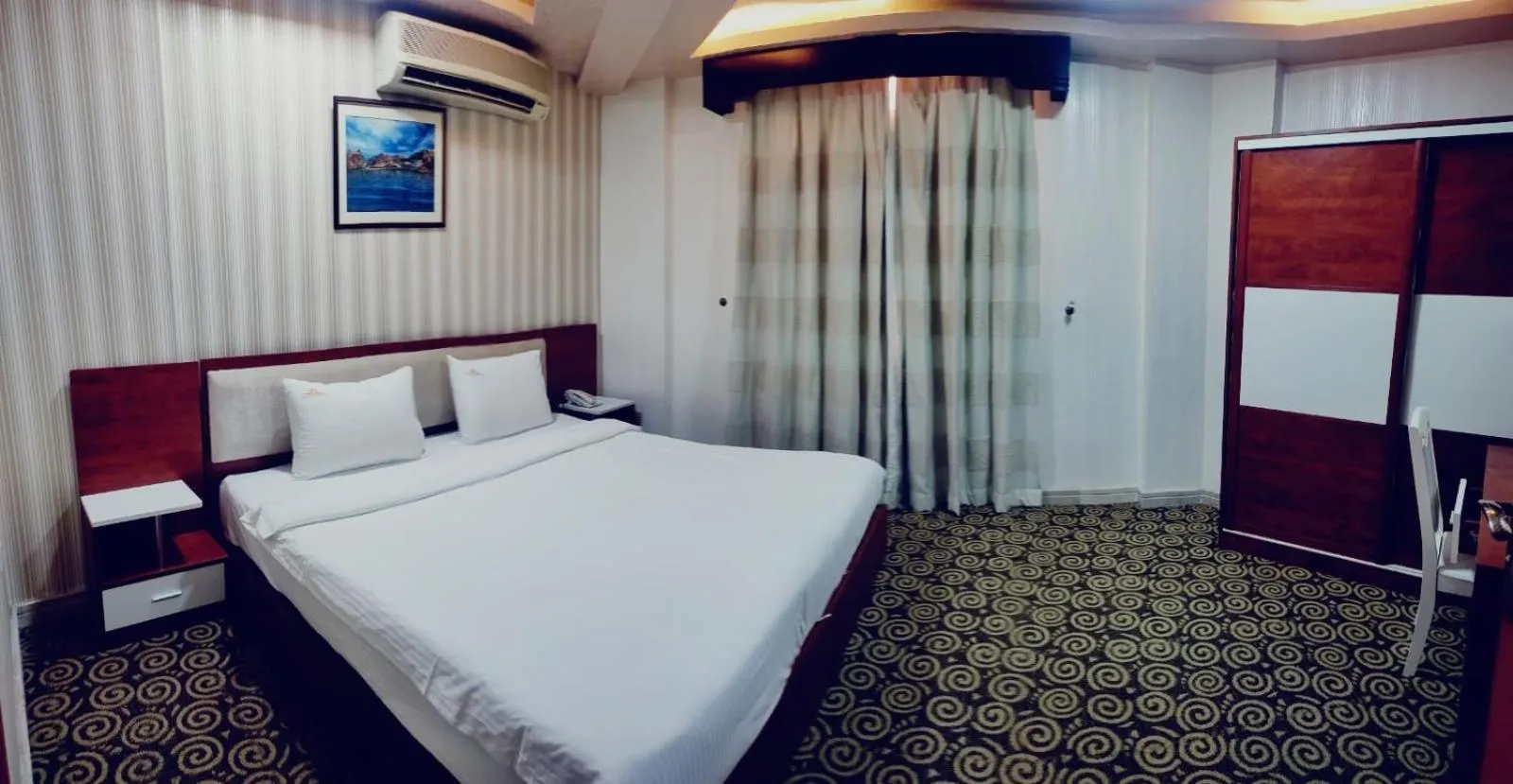 Photo of the whole room, Bed in Grand Inn Hotel