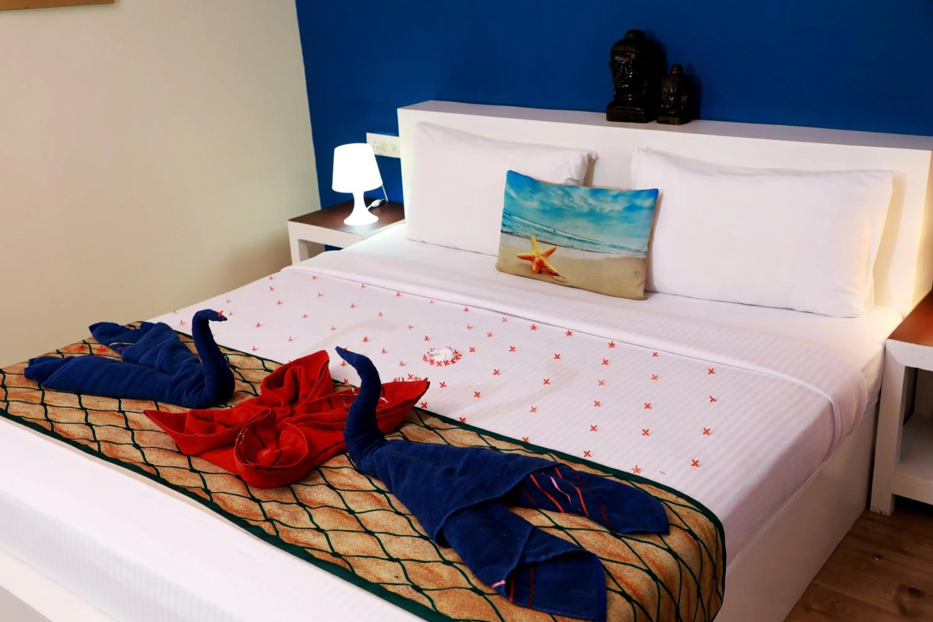 Bed in Phoenix Island Resort Poovar