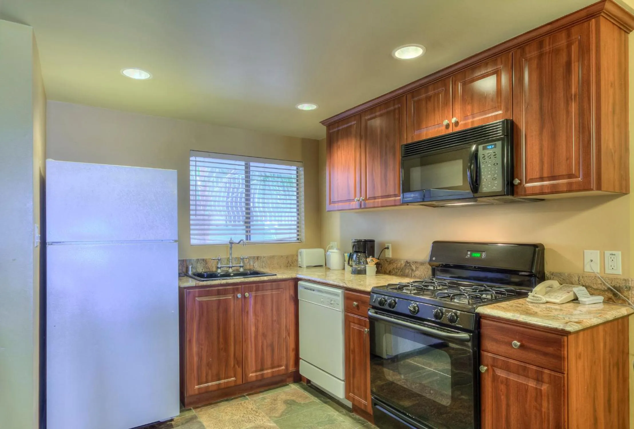 Kitchen or kitchenette in Oceanside Marina Suites - A Waterfront Hotel