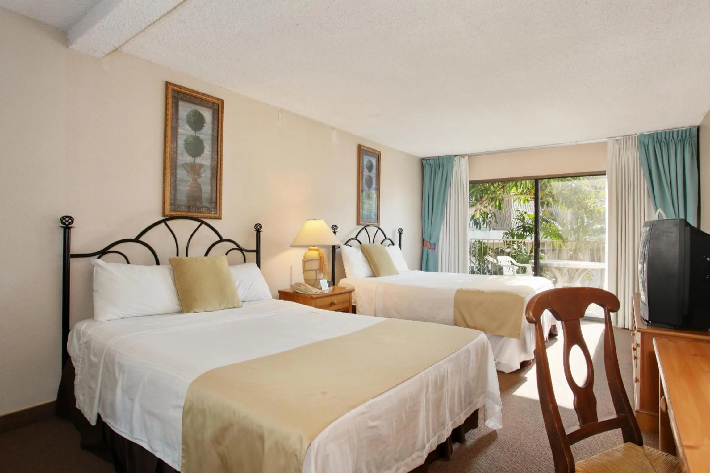 Bed in Oceanside Marina Suites - A Waterfront Hotel