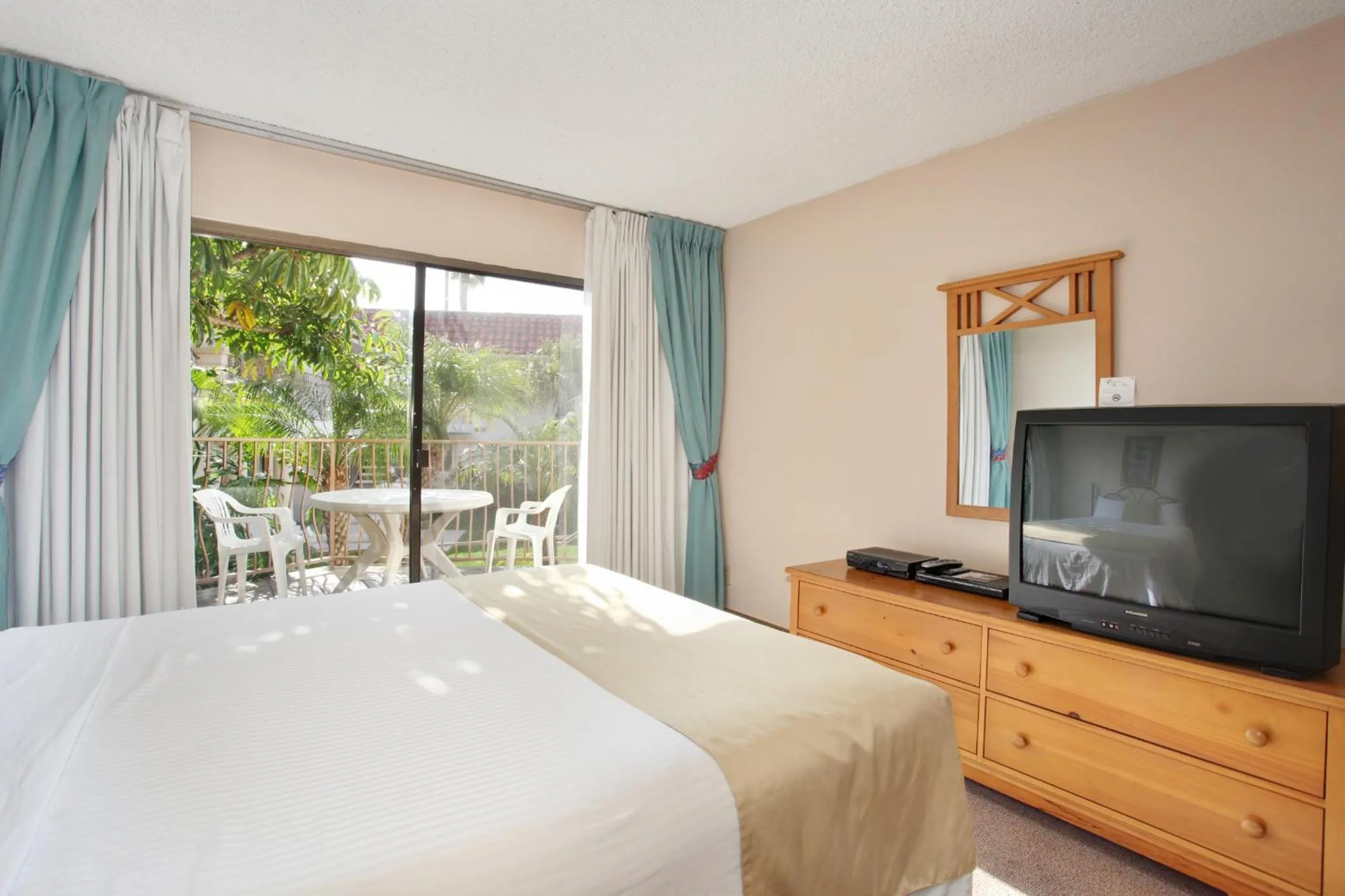 Bed in Oceanside Marina Suites - A Waterfront Hotel