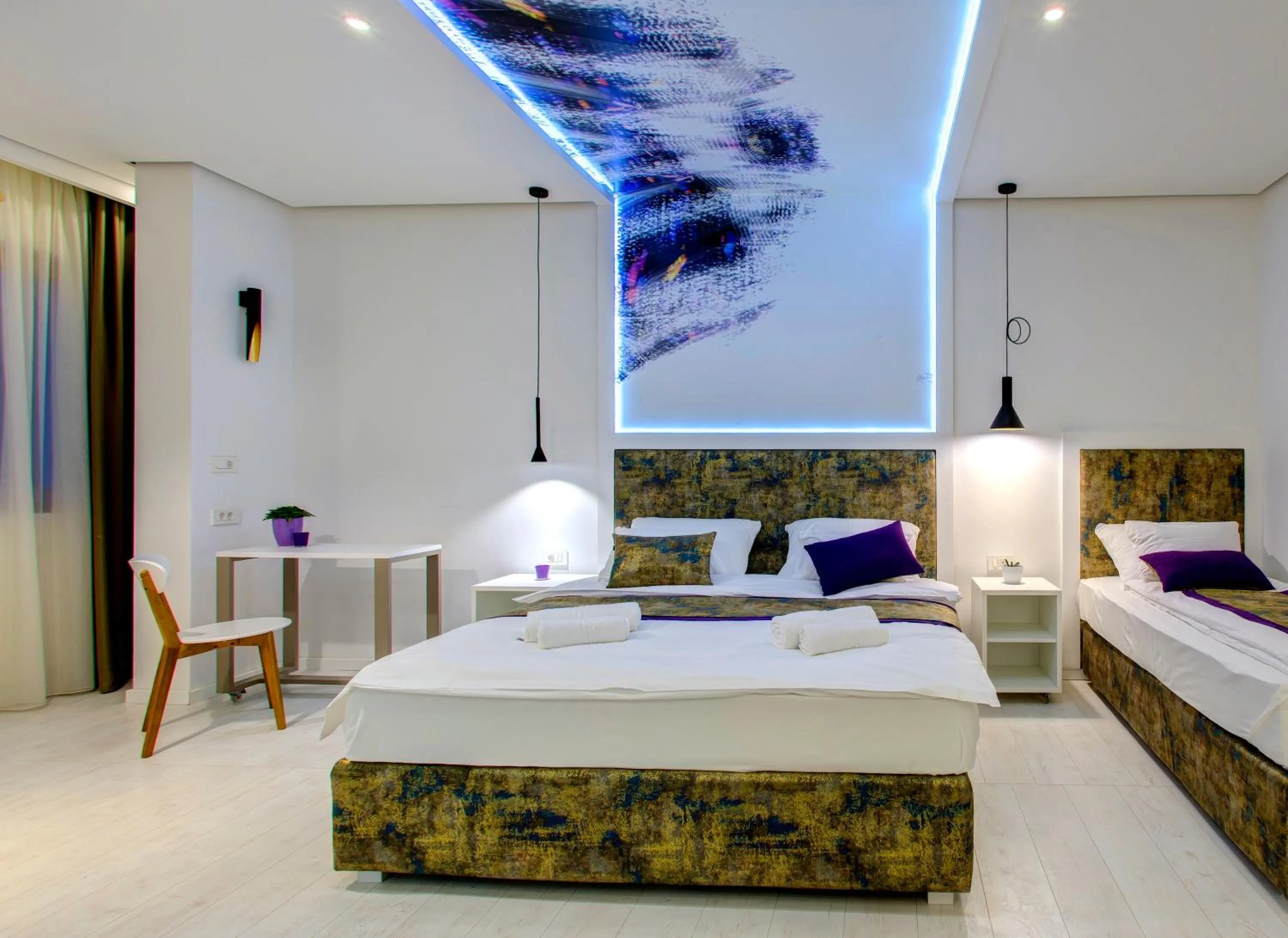 Bed in Diamond Rain Boutique Hotel