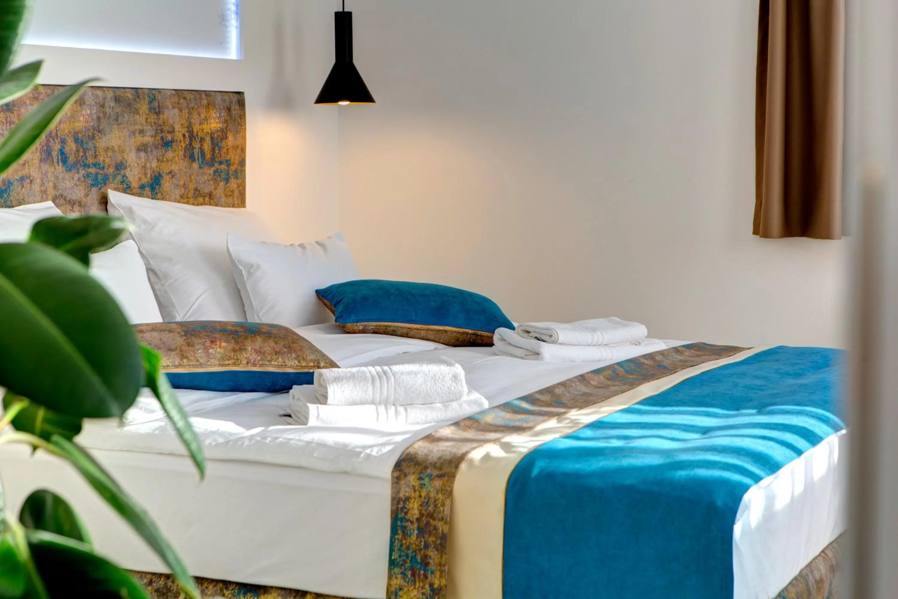 Bed in Diamond Rain Boutique Hotel