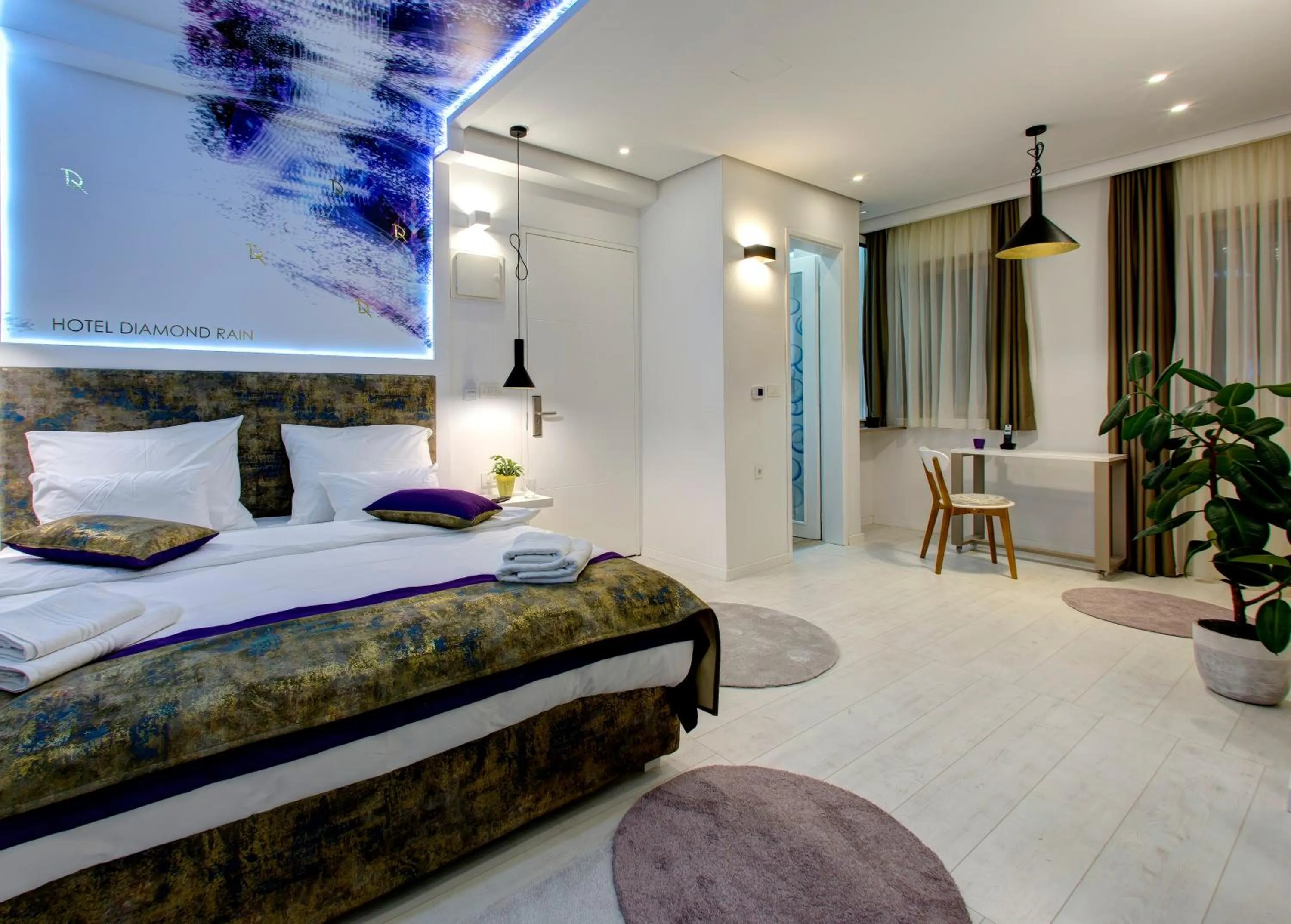 Bed in Diamond Rain Boutique Hotel